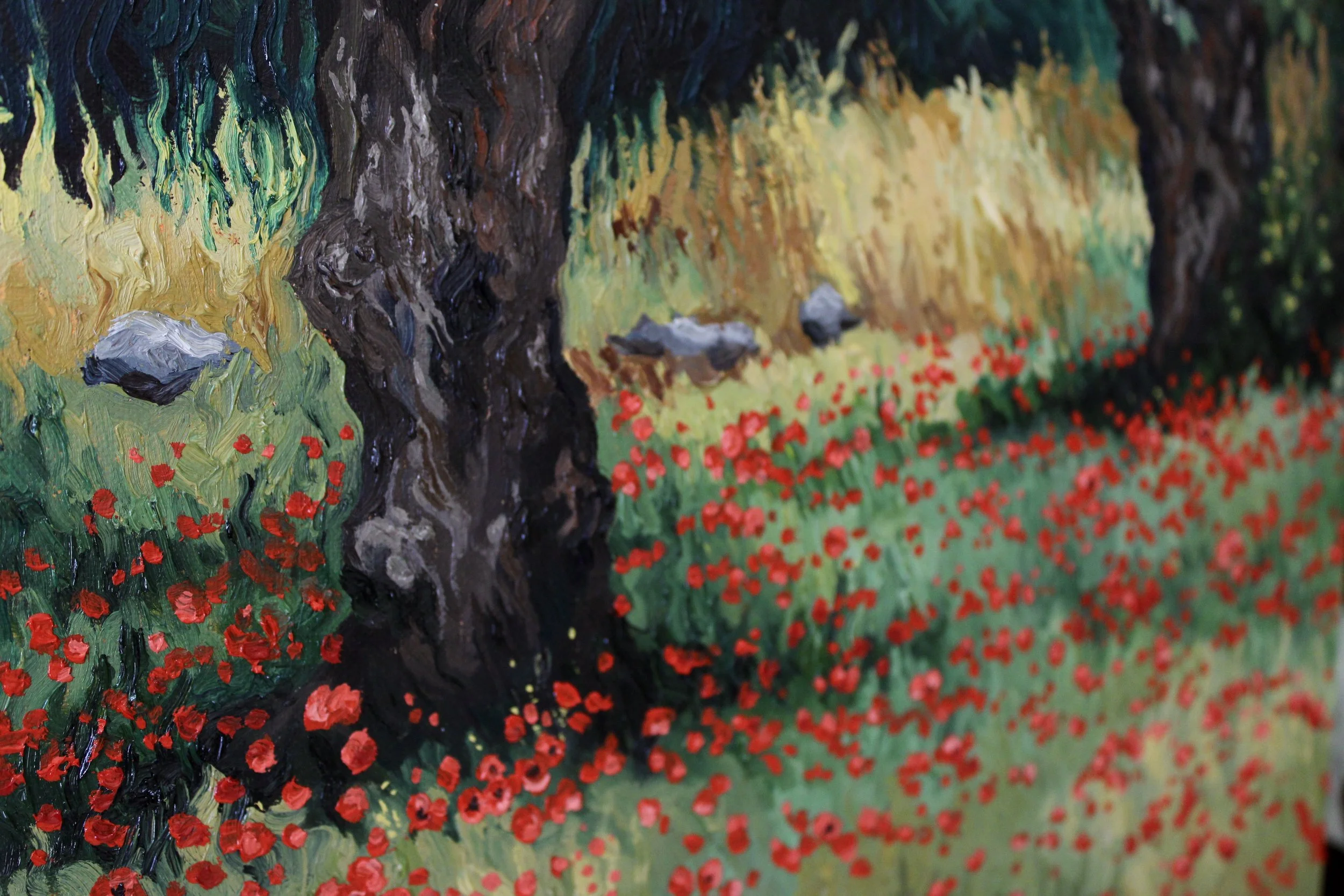 Another detail view of the painting, emphasizes the poppy fields