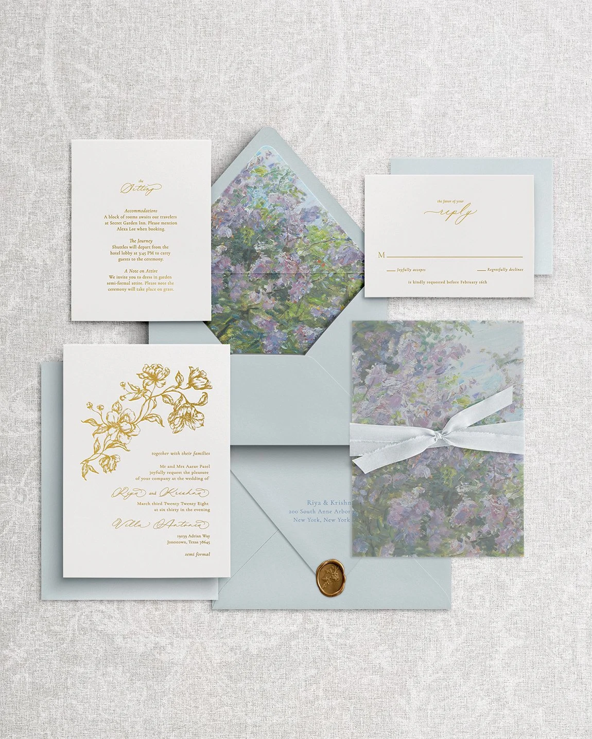 Elegant and simple wedding invitation suite with gold calligraphy, floral envelope liner, silk-tied vellum wrap, and wax seal.