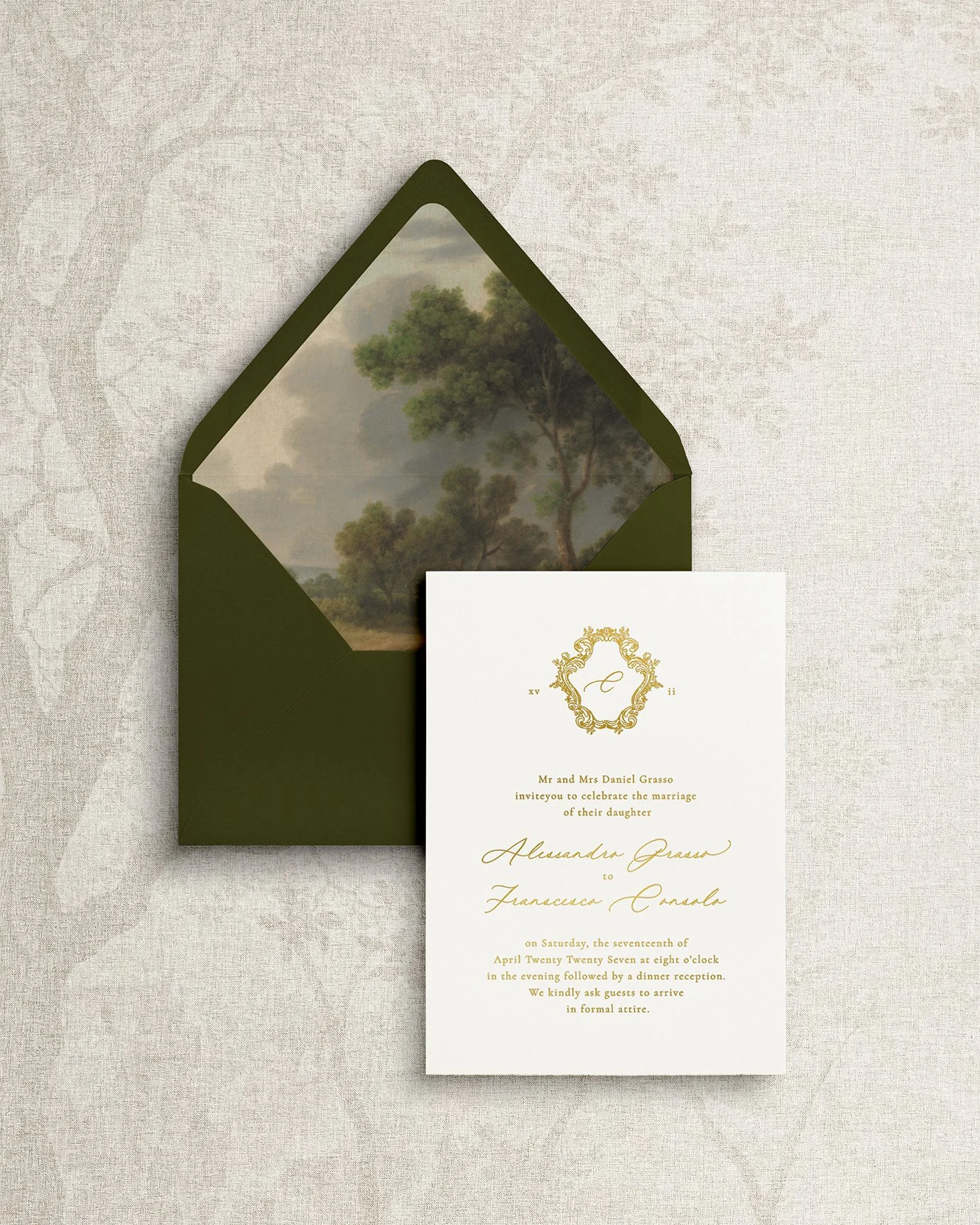 Elegant and simple wedding invitation suite featuring gold foil calligraphy and landscape-themed details.