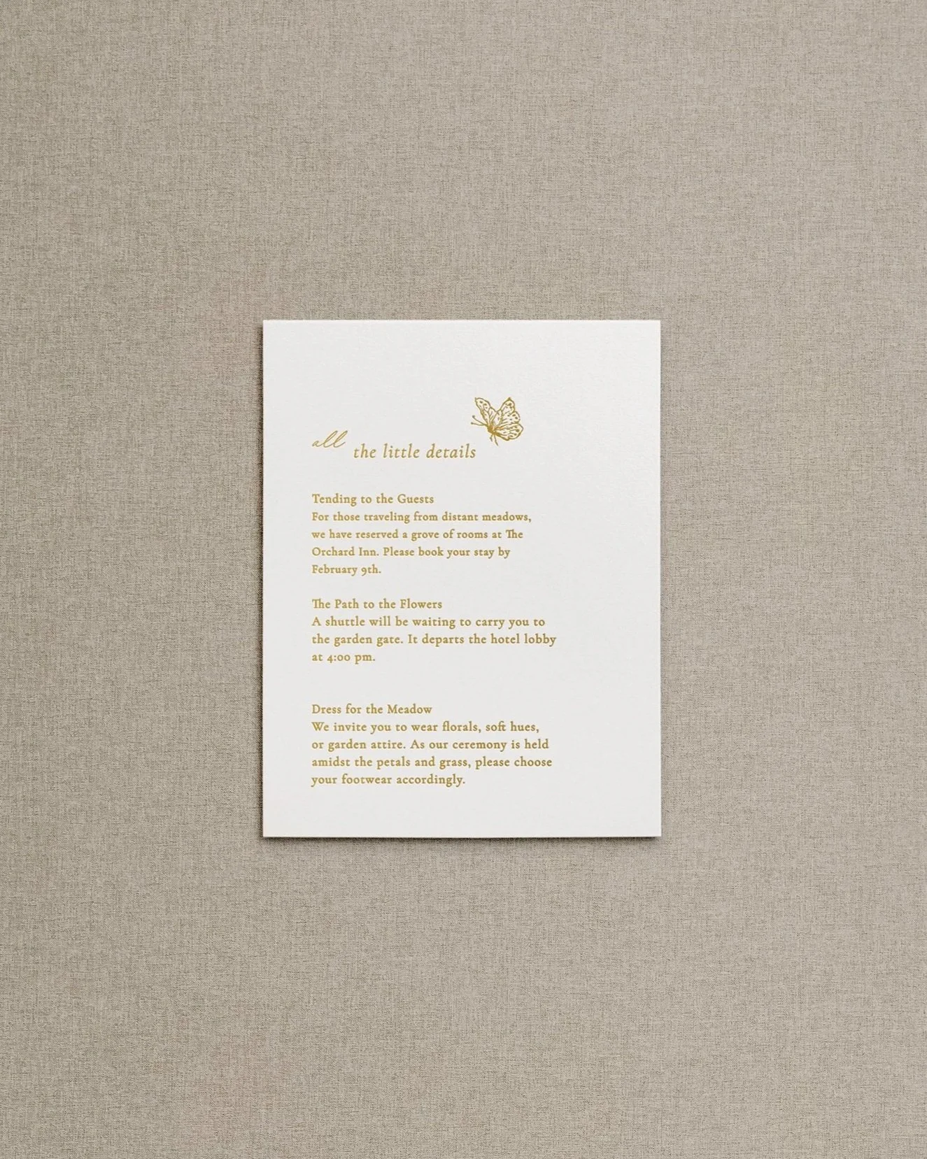 Gold foil letter pressed mixed calligraphy text on white cardstock with fine art butterfly.