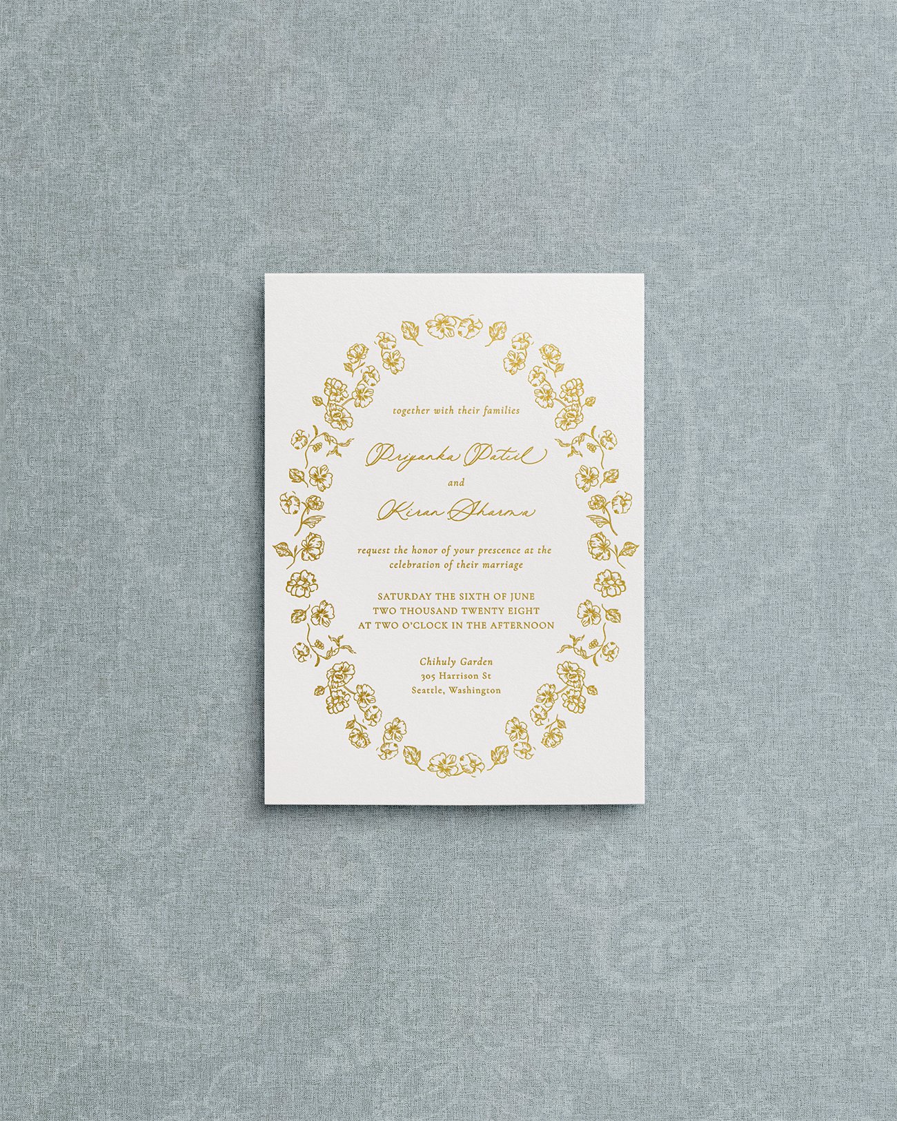 Floral botanical crest with gold letterpress calligraphy on matte premium  cardstock.