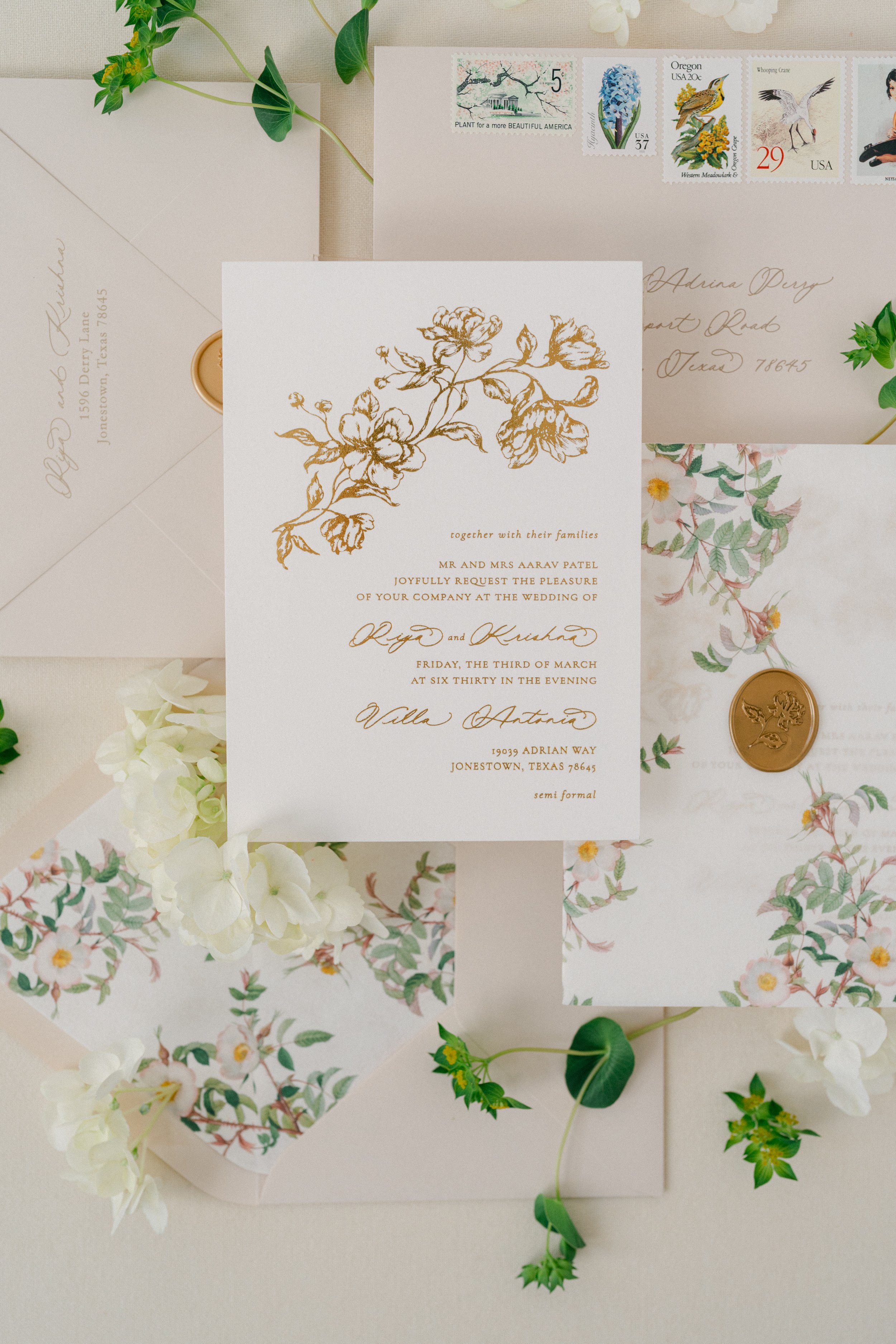 Gold foil floral wedding invitation close up flatlay