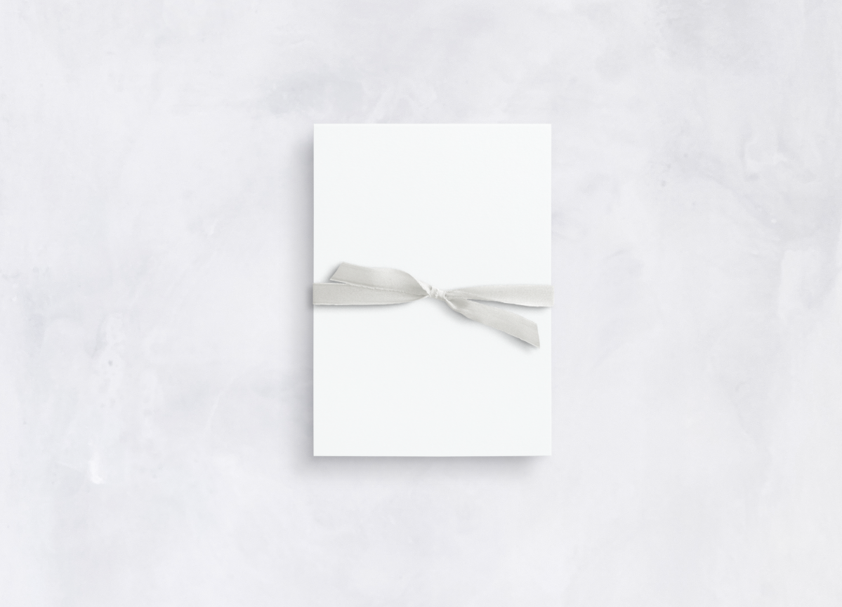 Ivory silk ribbon tied in decorative knot