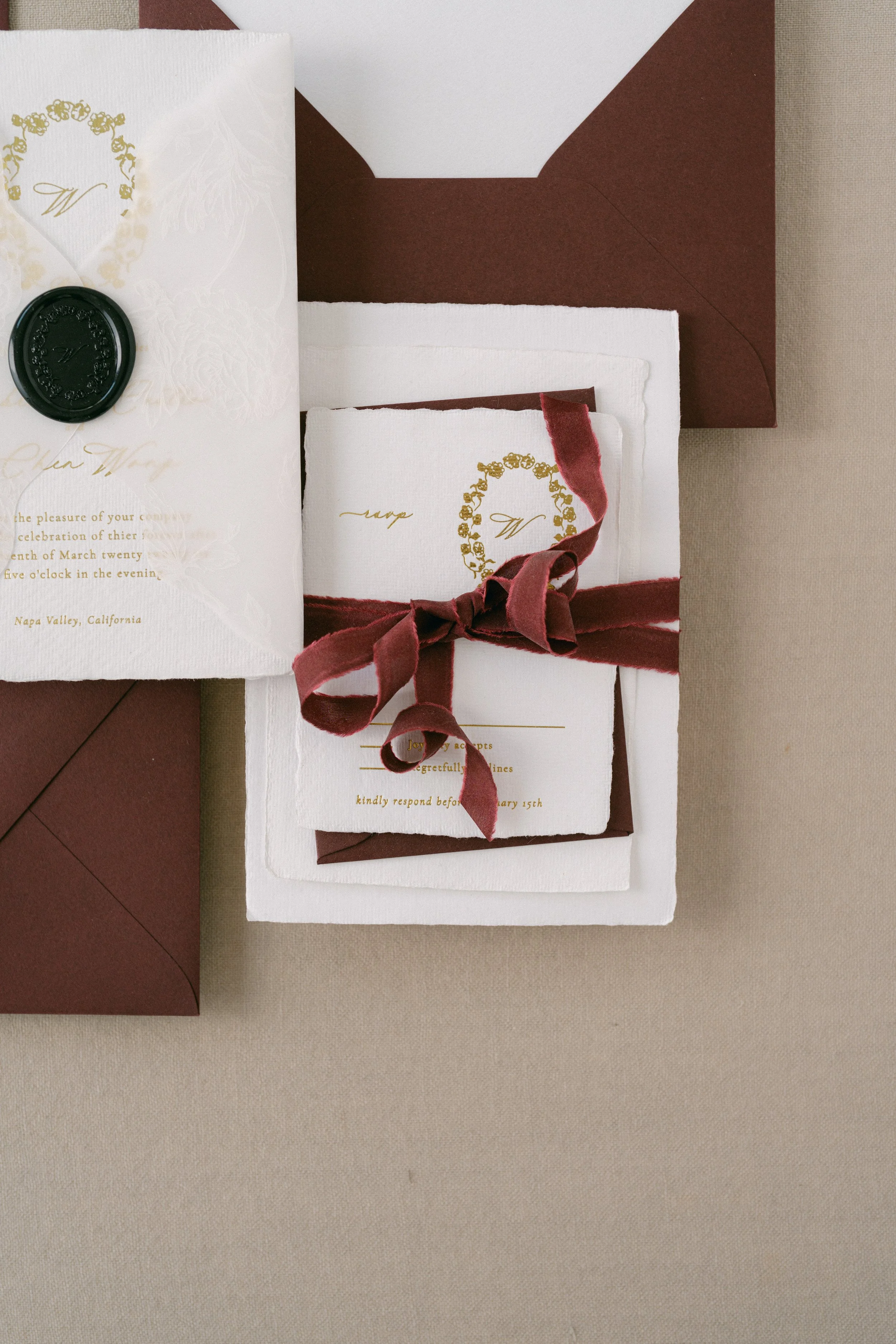 Burgundy handmade paper wedding invtation with burgundy ribbon