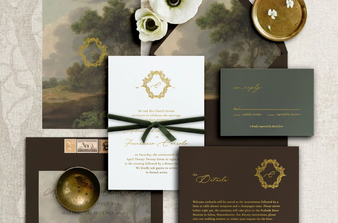 Heirloom wedding invitation suite featuring gold foil calligraphy on handmade paper, a dark green velvet ribbon, and a chocolate brown details card with a gold crest.