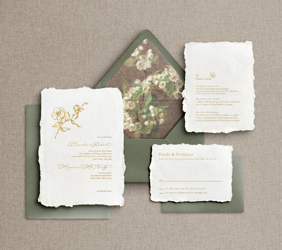Signature wedding invitation: gold foil letterpress on white handmade paper with a floral liner and an olive green envelope.