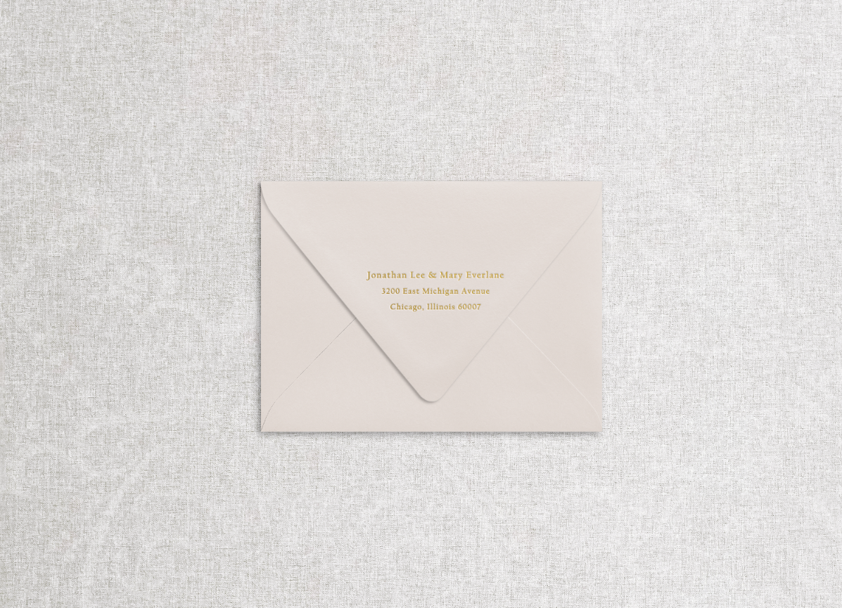 Foil printed return address on champagne beige envelope in the style of "head over heels" suite