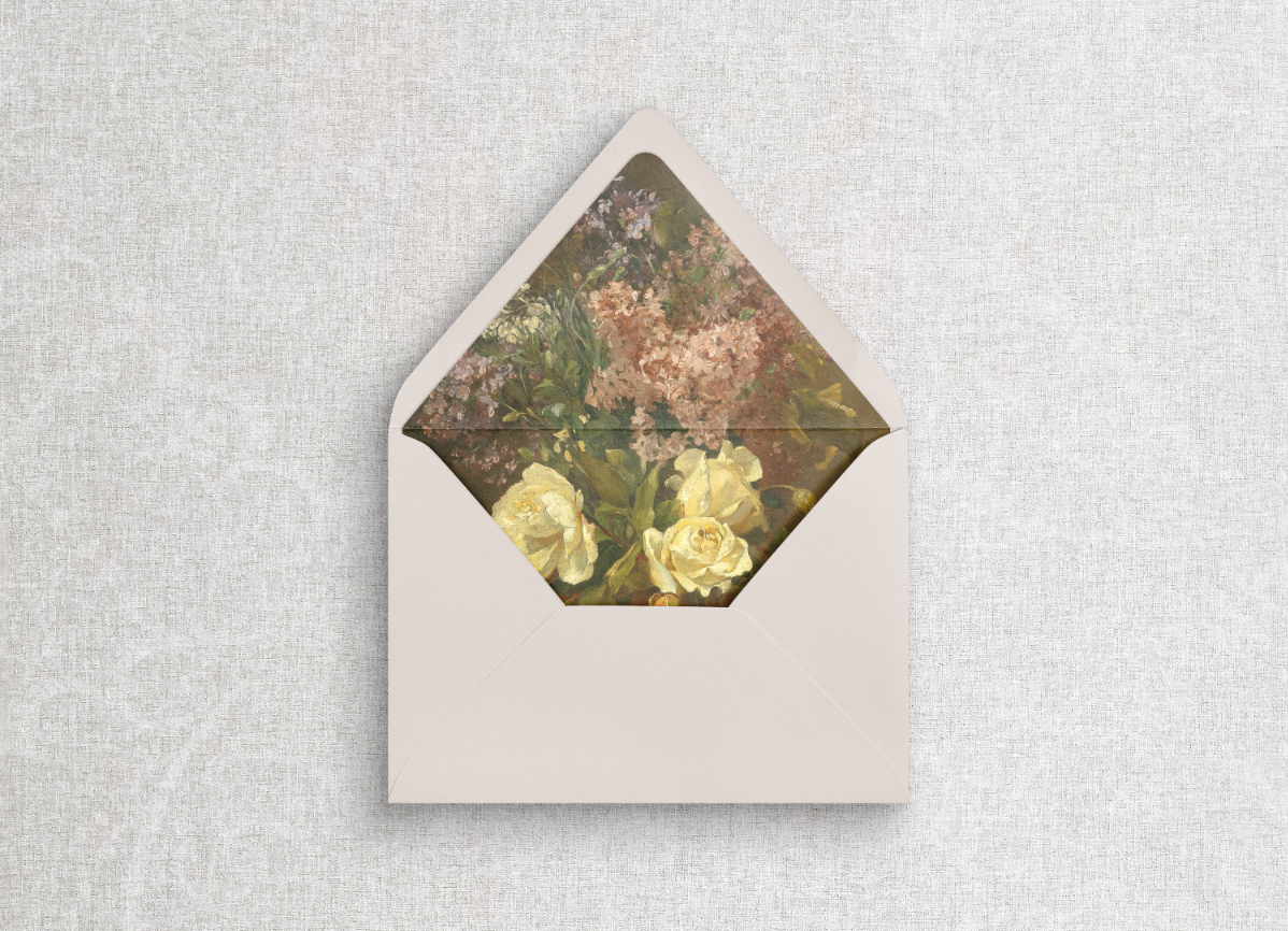Champagne beige euro flap envelope with floral liner on gray flat lay background.