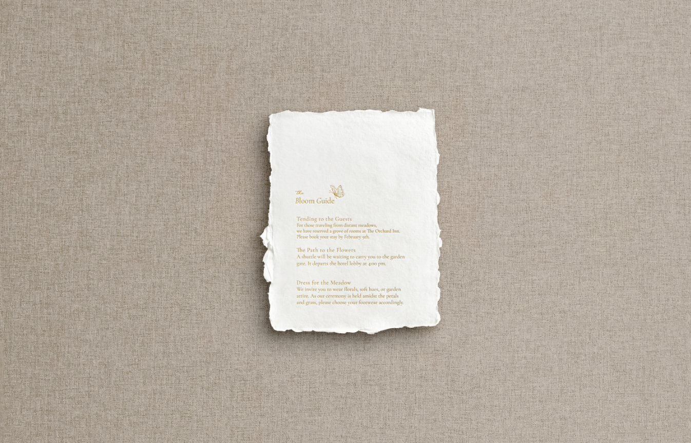 Details card on white hand made paper with gold foil print mix of calligraphy with accent butterfly.