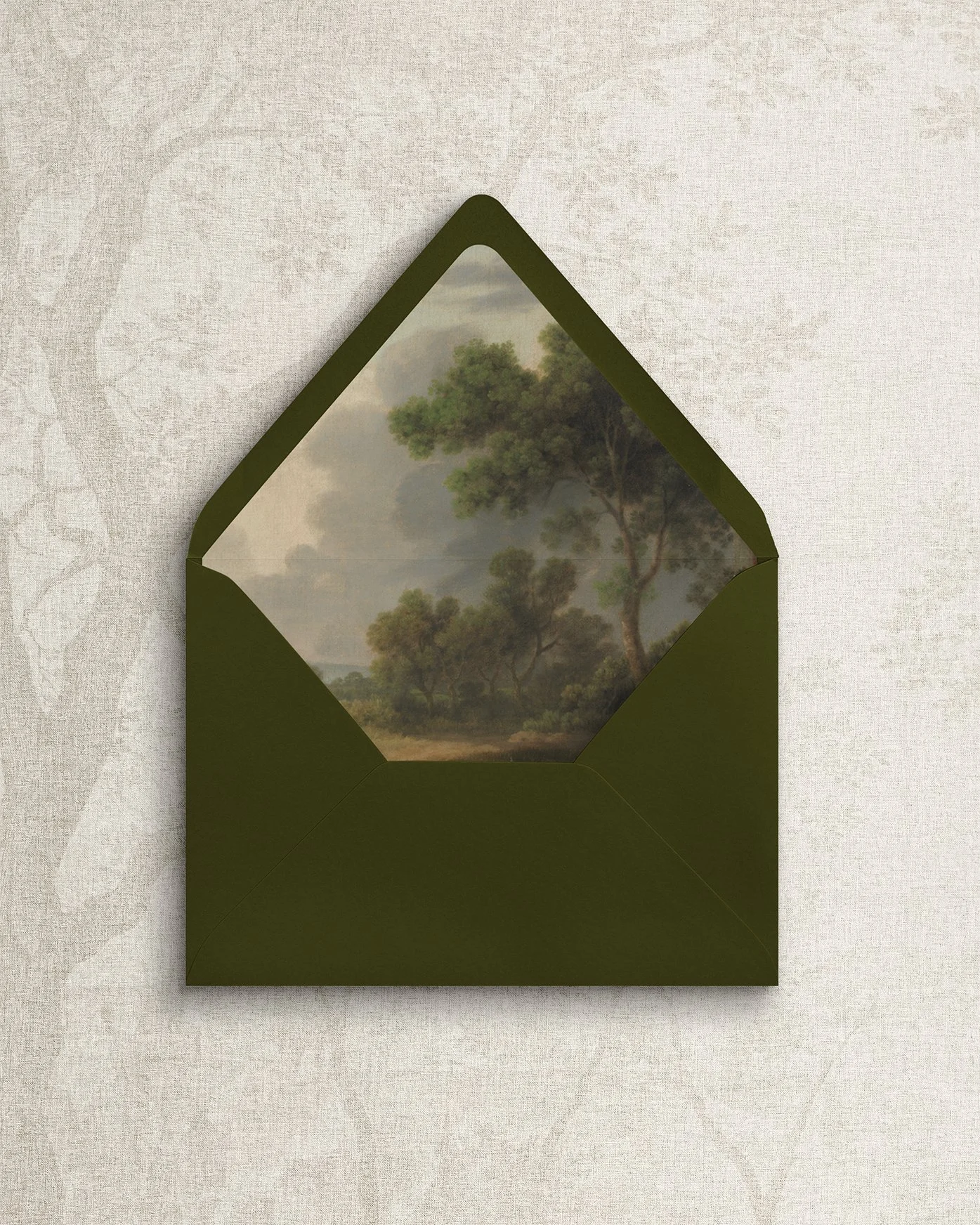 Simple and elegant wedding envelope stationery featuring a landscape-themed art liner.