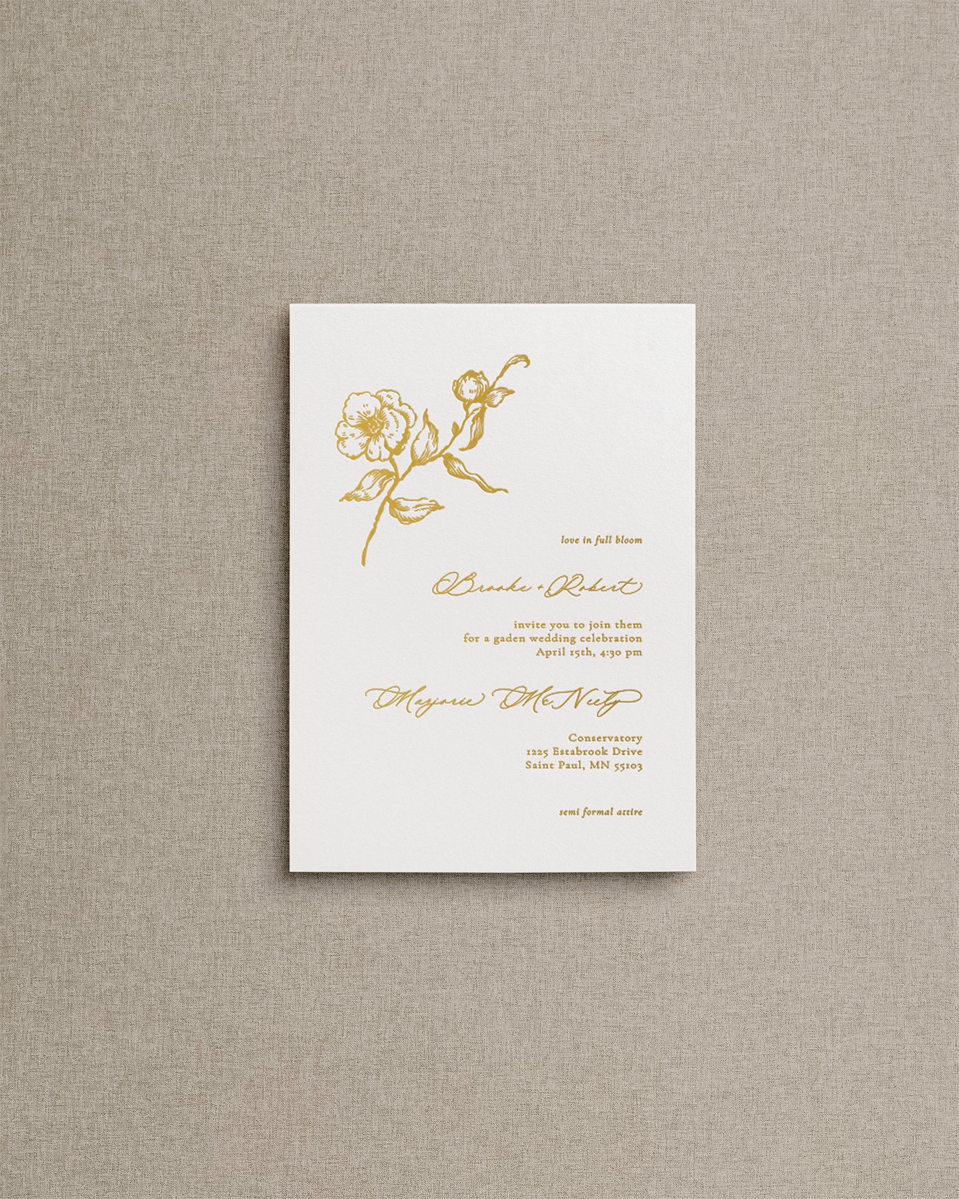 Elegant, simple wedding invitation card with gold foil calligraphy and botanical floral illustration.