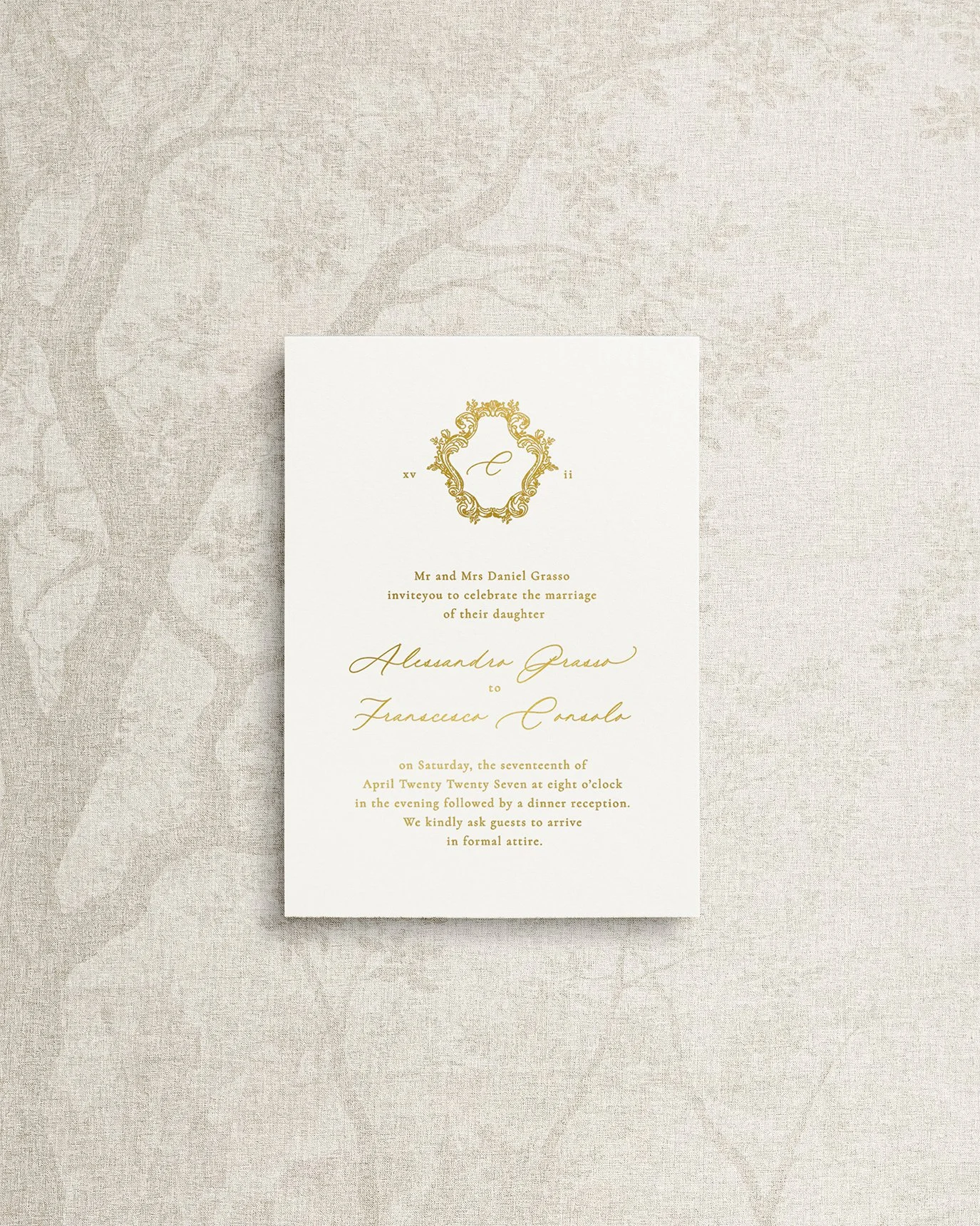 Main invitation on soft white cardstock with heirloom crest and gold foil letterpress calligraphy.