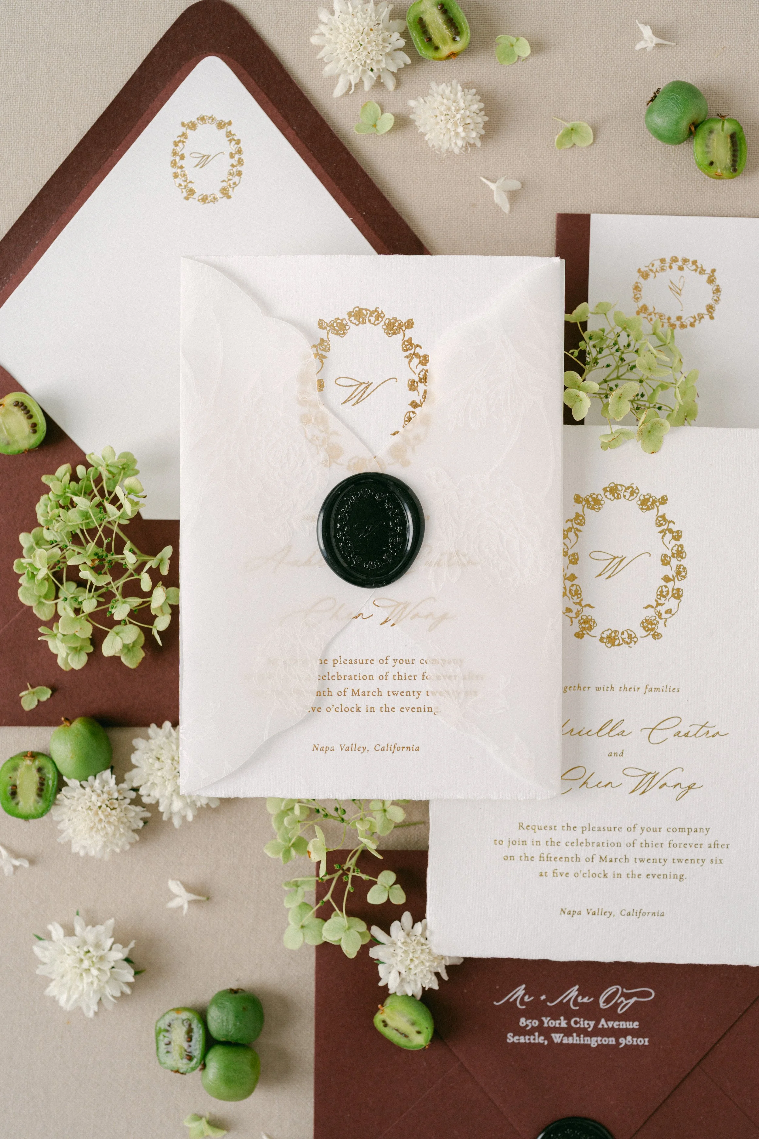 handmade paper wedding invitation flatlay deep burgundy and white