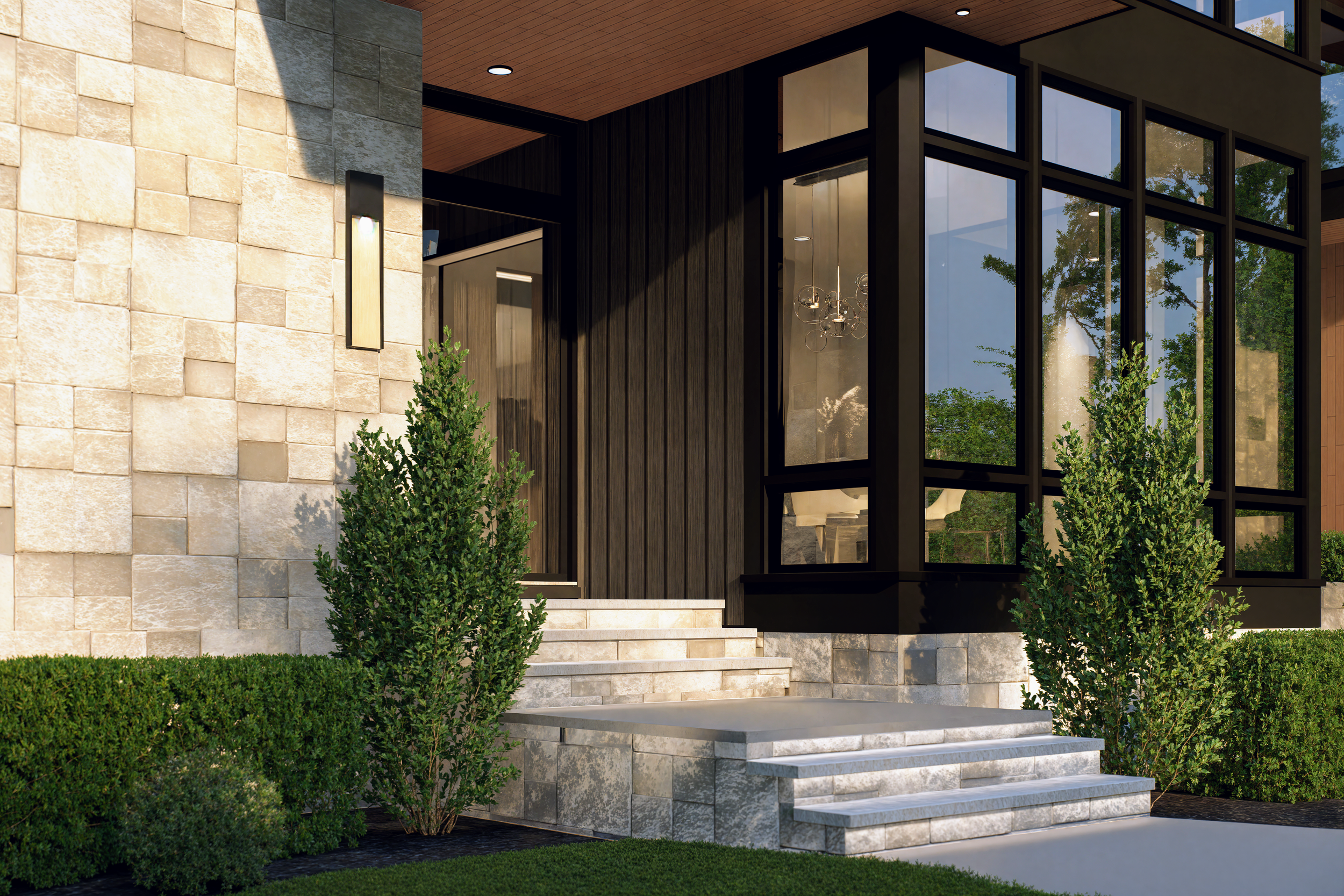Modern house entrance with stone steps, black-framed glass windows, green shrubs, and a wall-mounted light fixture.