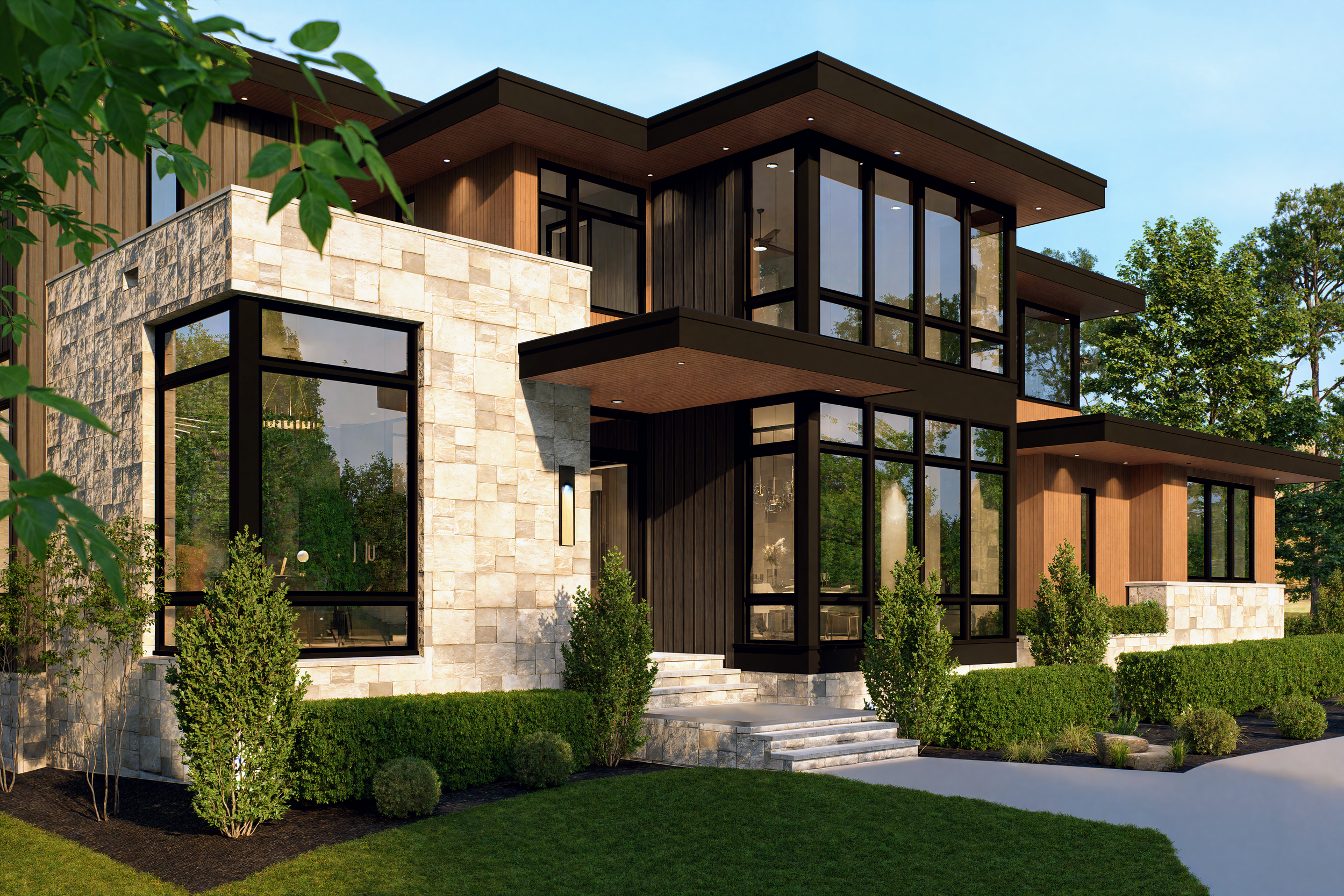 Modern multi-level house with large glass windows, stone and wood exterior, surrounded by manicured lawn and trees.