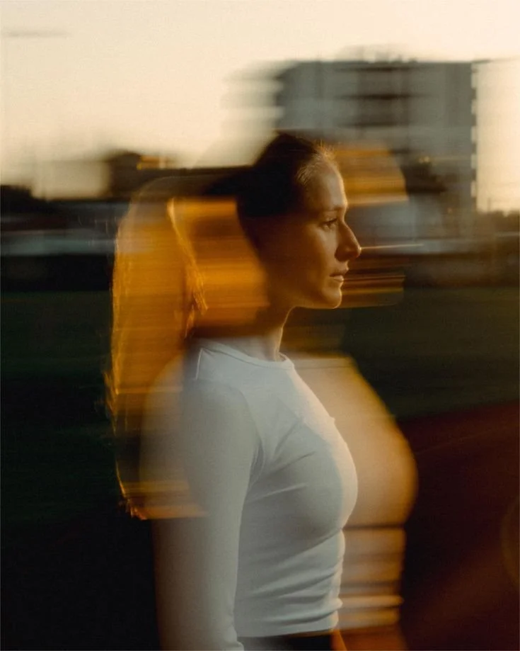 Women stands in a blur