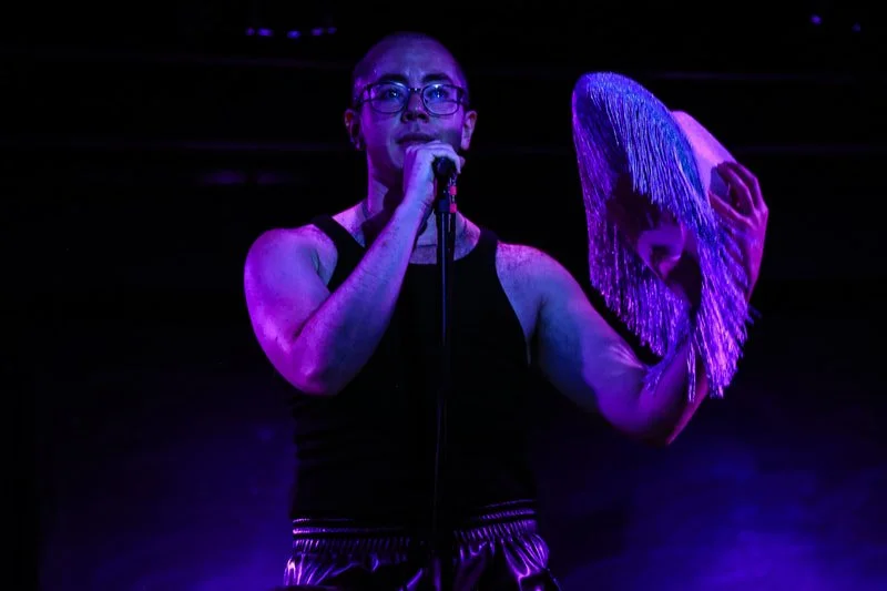 neo-futurists-pride-lee-singing.jpeg