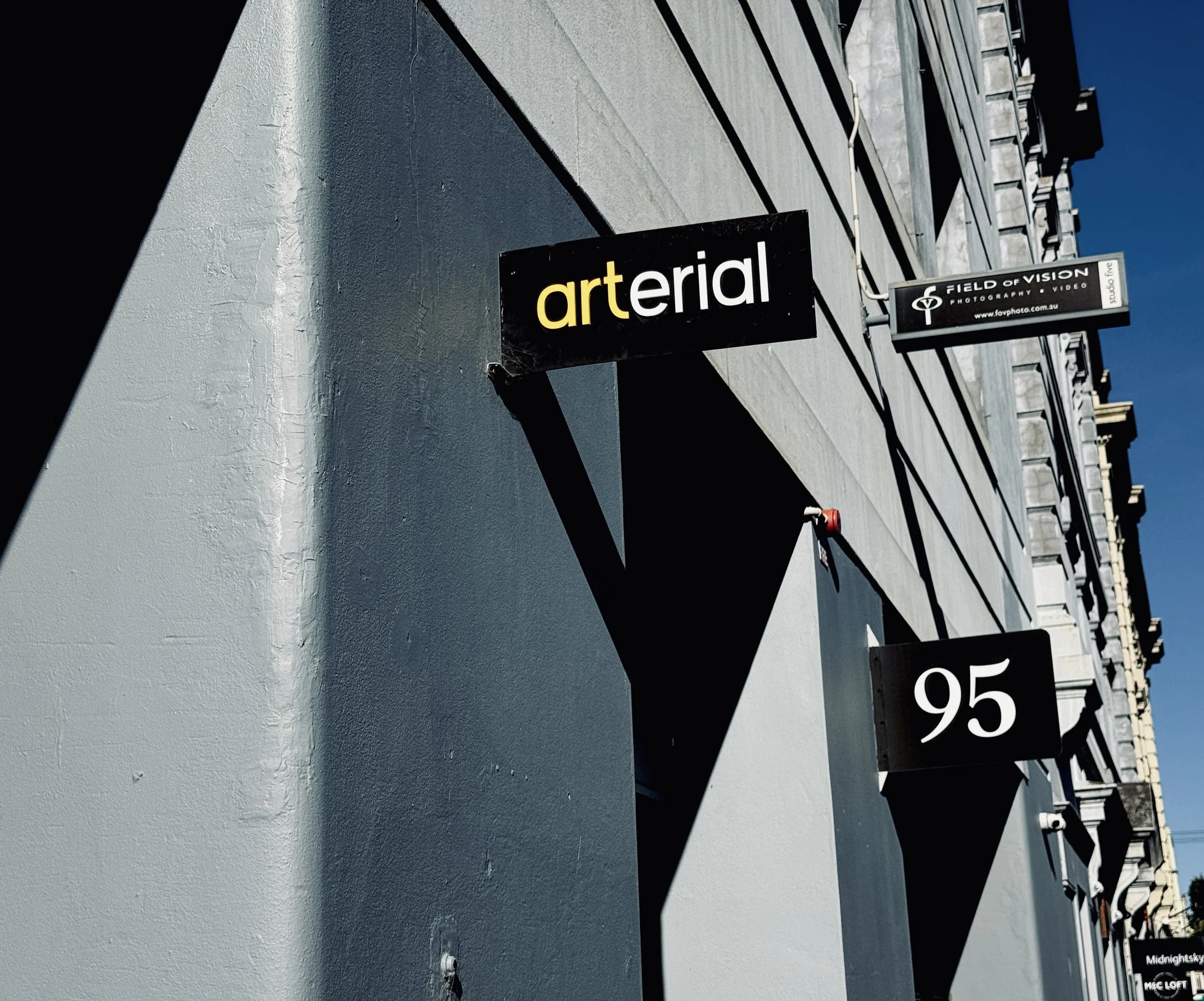 close up photo of Arterial and number 95 signage on the side of a building