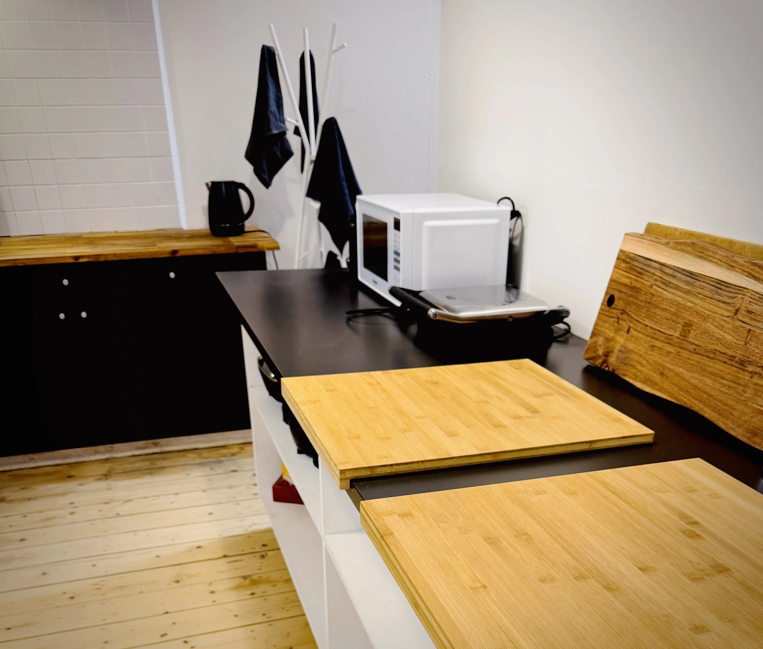 kitchen counter setup with cutting boards and kitchen appliances