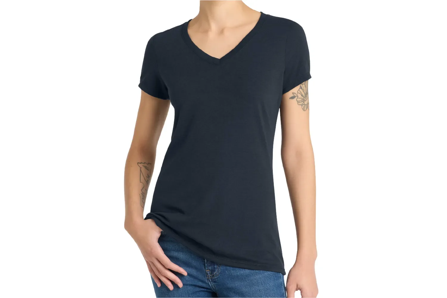 Black sleeveless tunic top worn by a woman with long wavy brown hair, paired with blue jeans.
