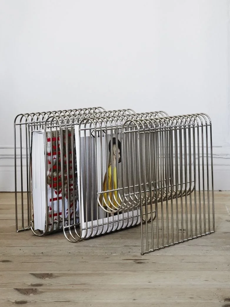 Magazine racks are practical sculptures. Hold your favourite magazines, records or books while simultaneously displaying art. Yes please!