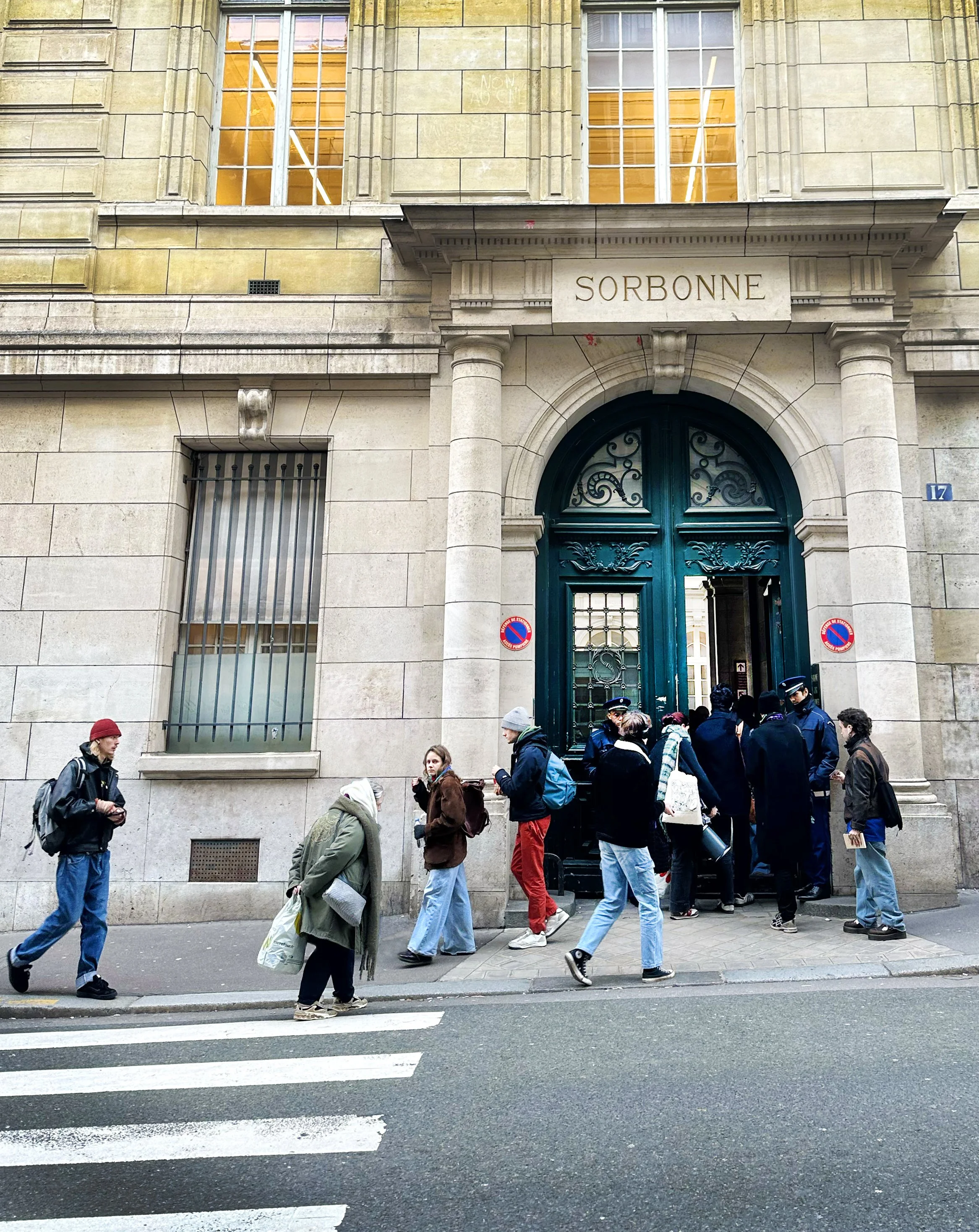 People waiting outside the Sorbonne University entrance in Paris.