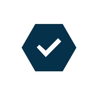 A checkmark inside a dark blue hexagon with a white border.