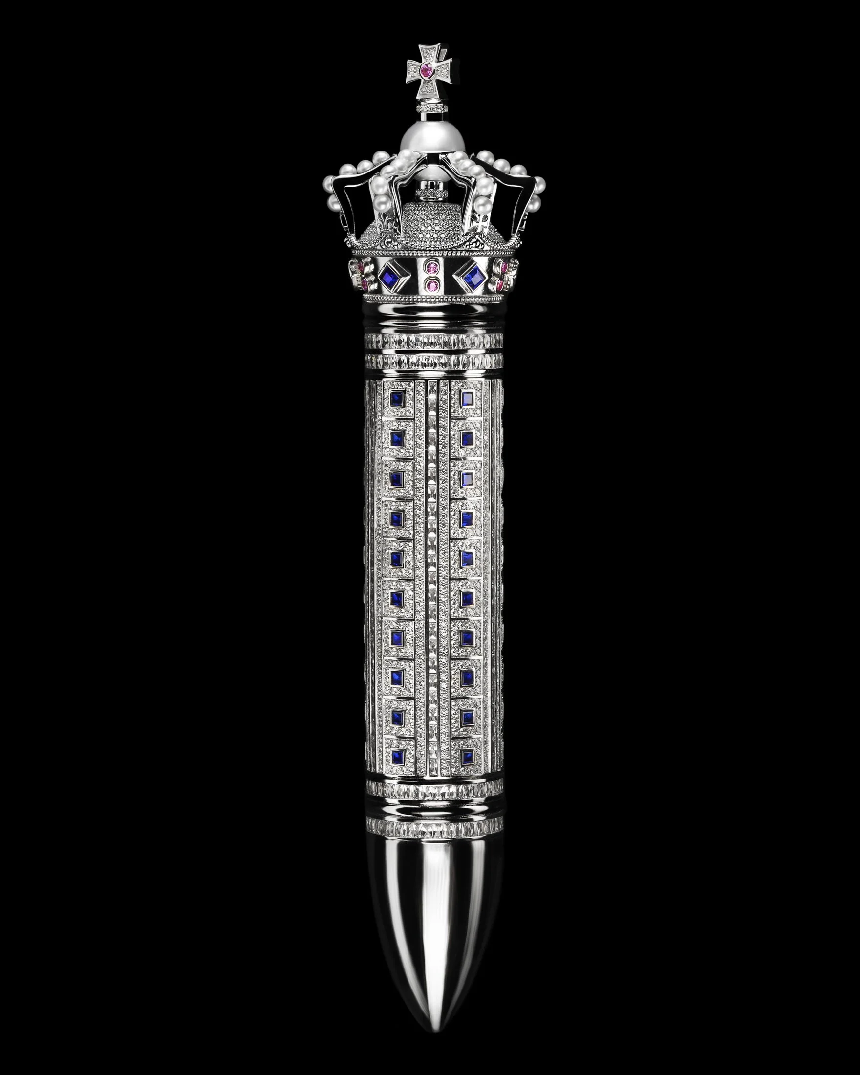 A luxury dagger with a jeweled handle featuring a crown and cross design, adorned with diamonds and sapphires, reflecting in a black background.