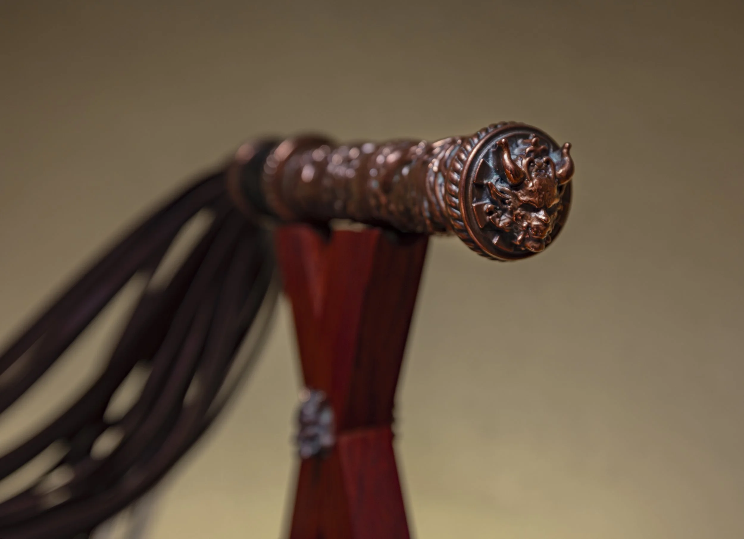 Close-up of a carved wooden gavel resting on a wooden block.