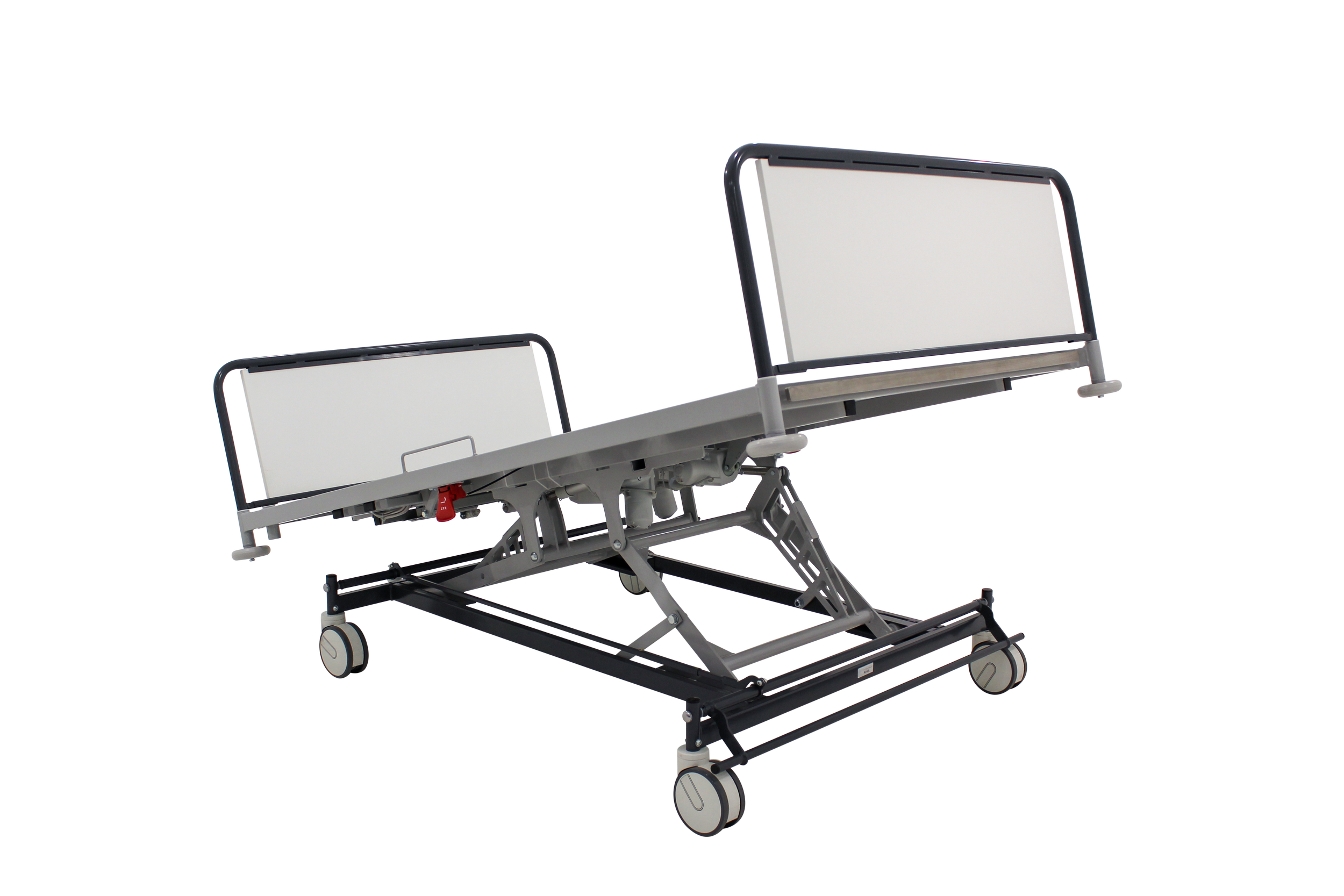 Hospital bed with white mattress, side rails, and a wheeled base, positioned at an angle.