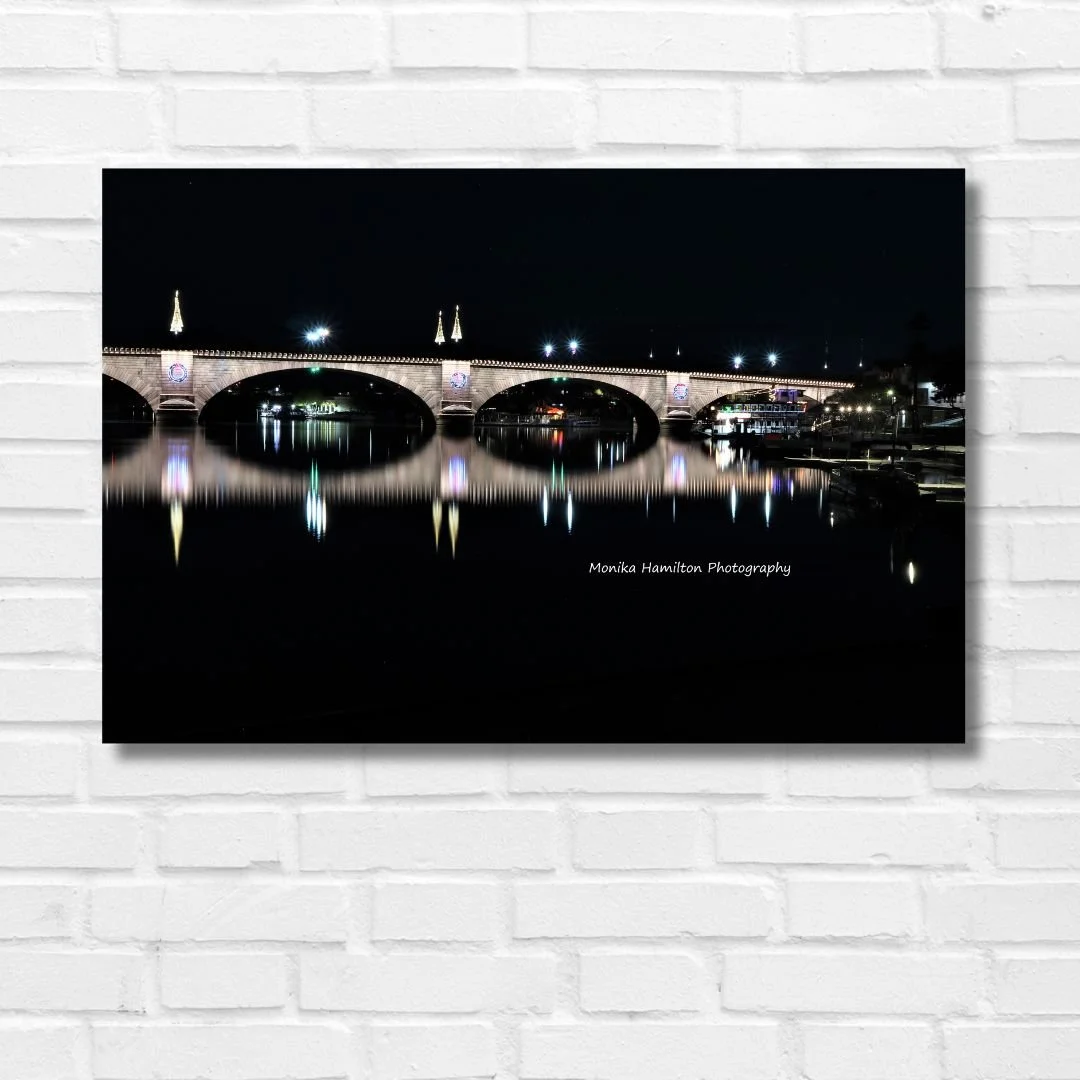 Lake Havasu City's London Bridge in Arizona - Nighttime long exposure with lights reflecting on the London Bridge Channel. Monika Hamilton Photography