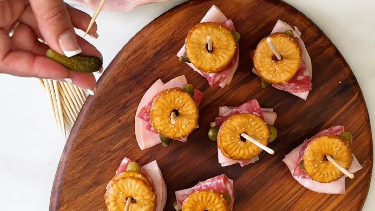 From above Pressed Pretzel Platter Bites on a wooden board