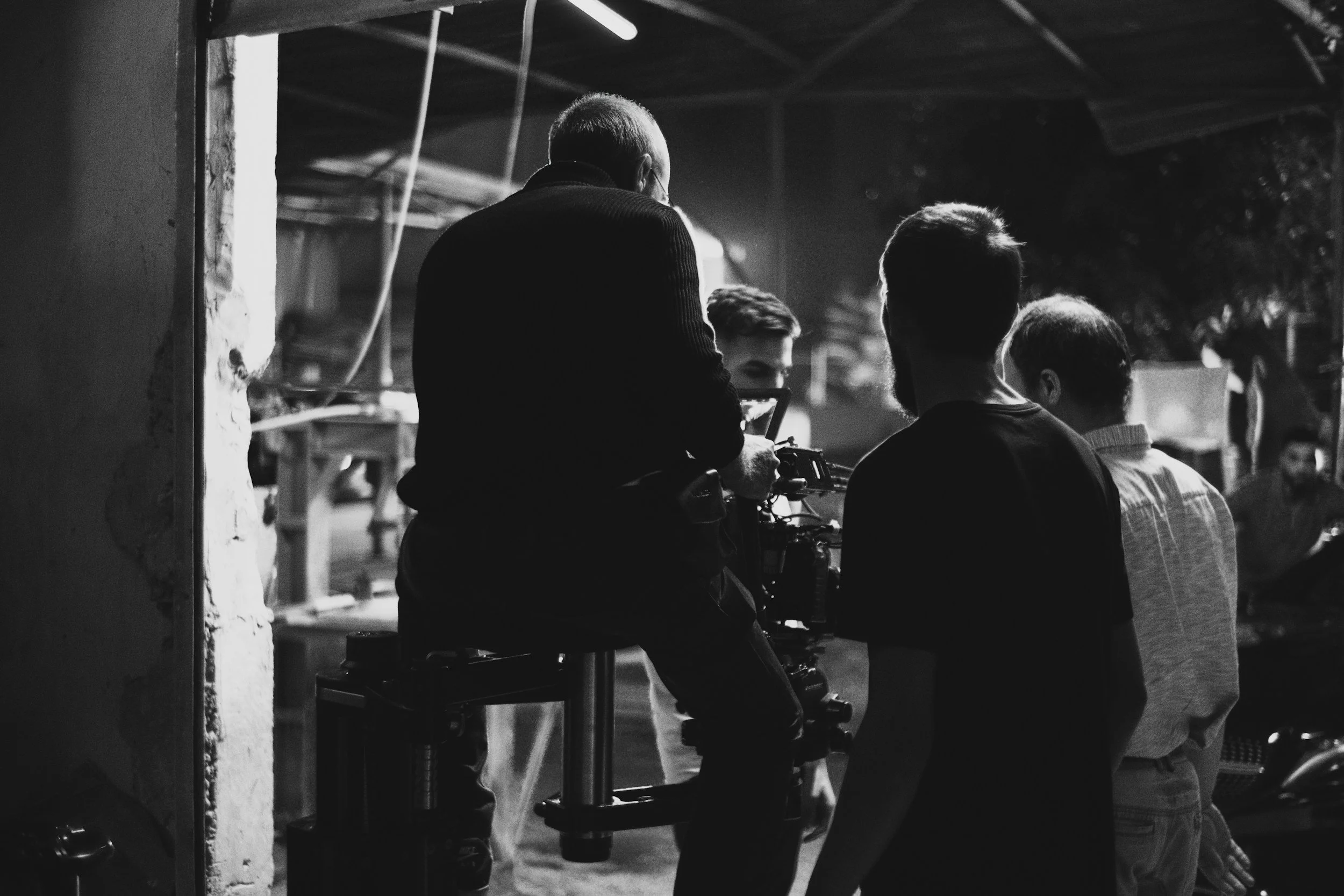Silhouette of film crew on a professional set, representing intermediate on-camera acting classes