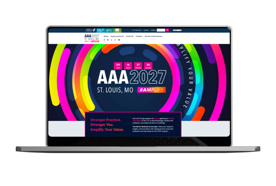 Laptop screen displaying the AAA 2027 conference webpage with colorful circular graphics, event details, countdown timer, and branding for St. Louis, Missouri.