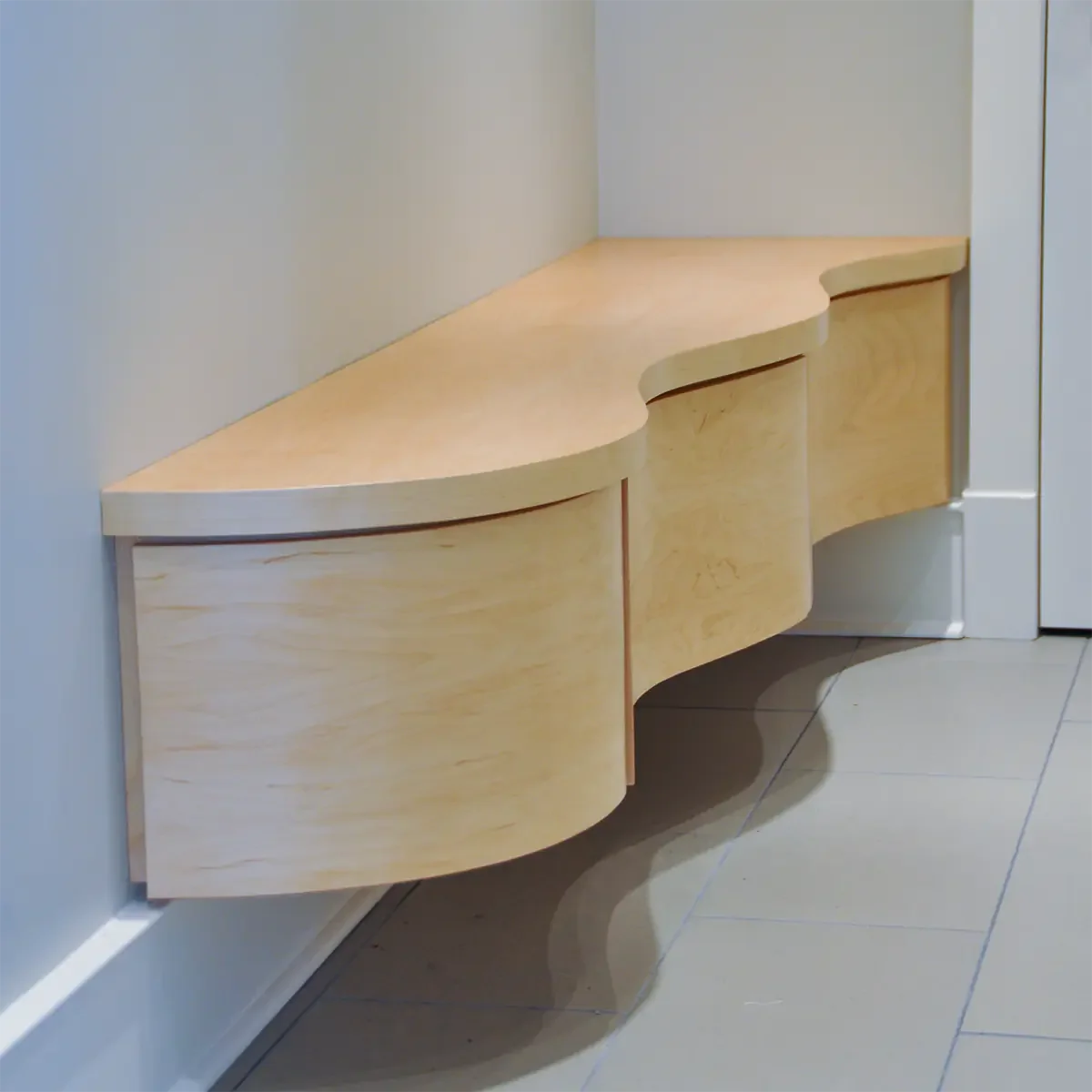 Custom floating wave style maple storage bench for Client in Ottawa (Westboro)