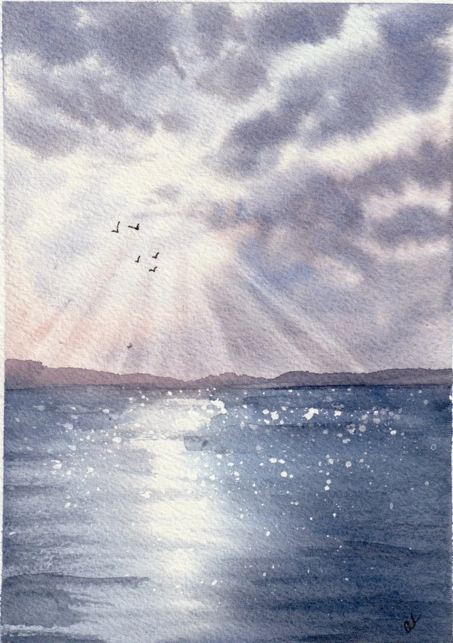 Watercolor painting of a seascape with a cloudy sky, distant land, and a flock of birds flying over the water with sunlight reflecting on the surface.