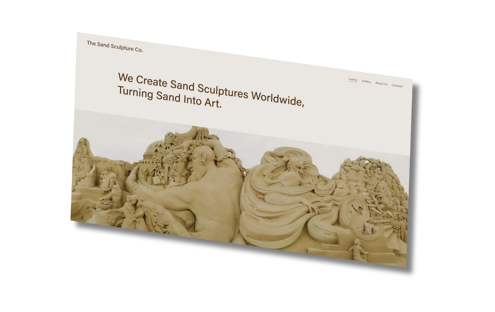 Sand sculpture website homepage with detailed sand sculpture of dragons and castles.