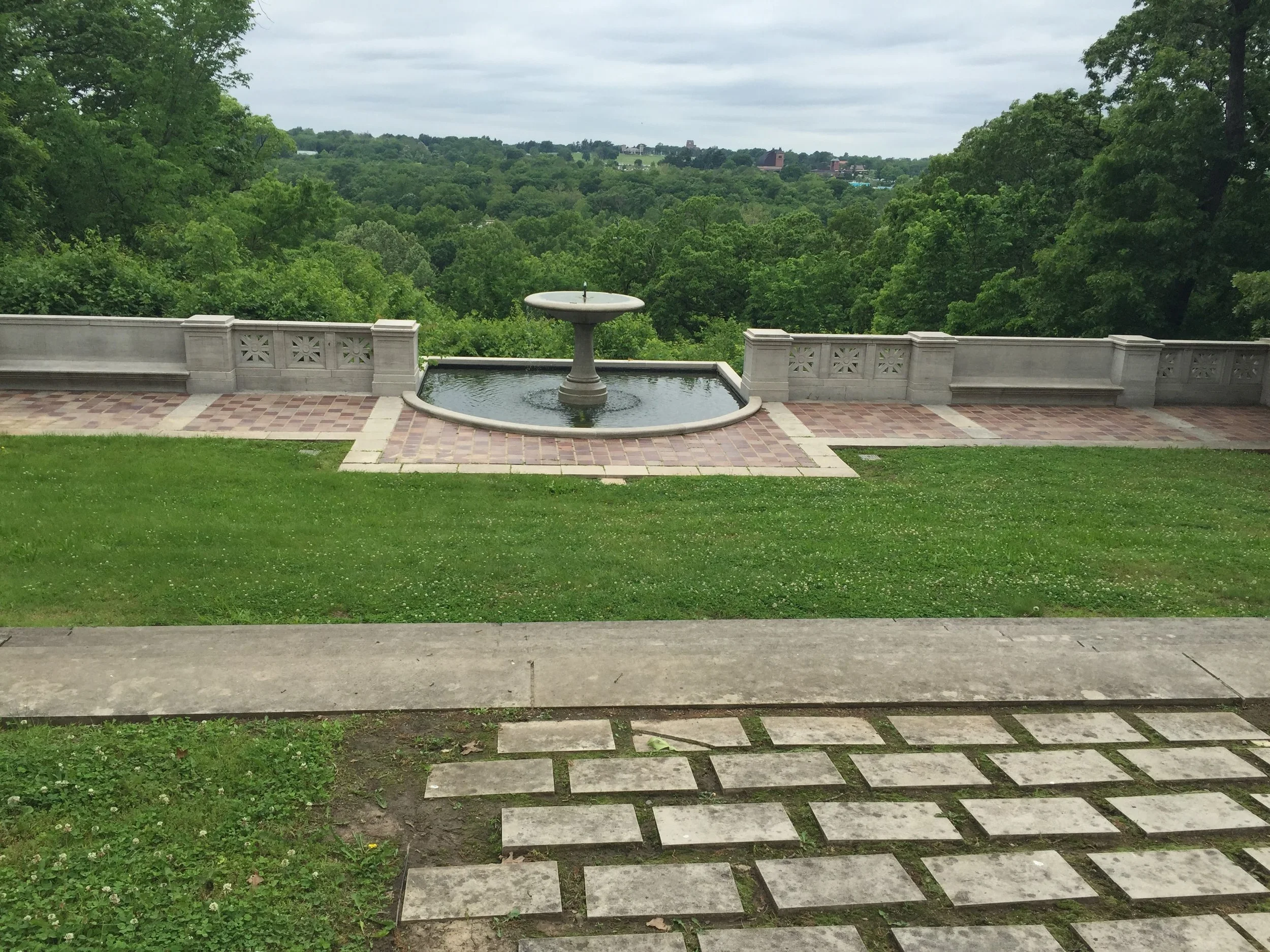 A water fountain in Swope Park in Kansas City overlooking the city.