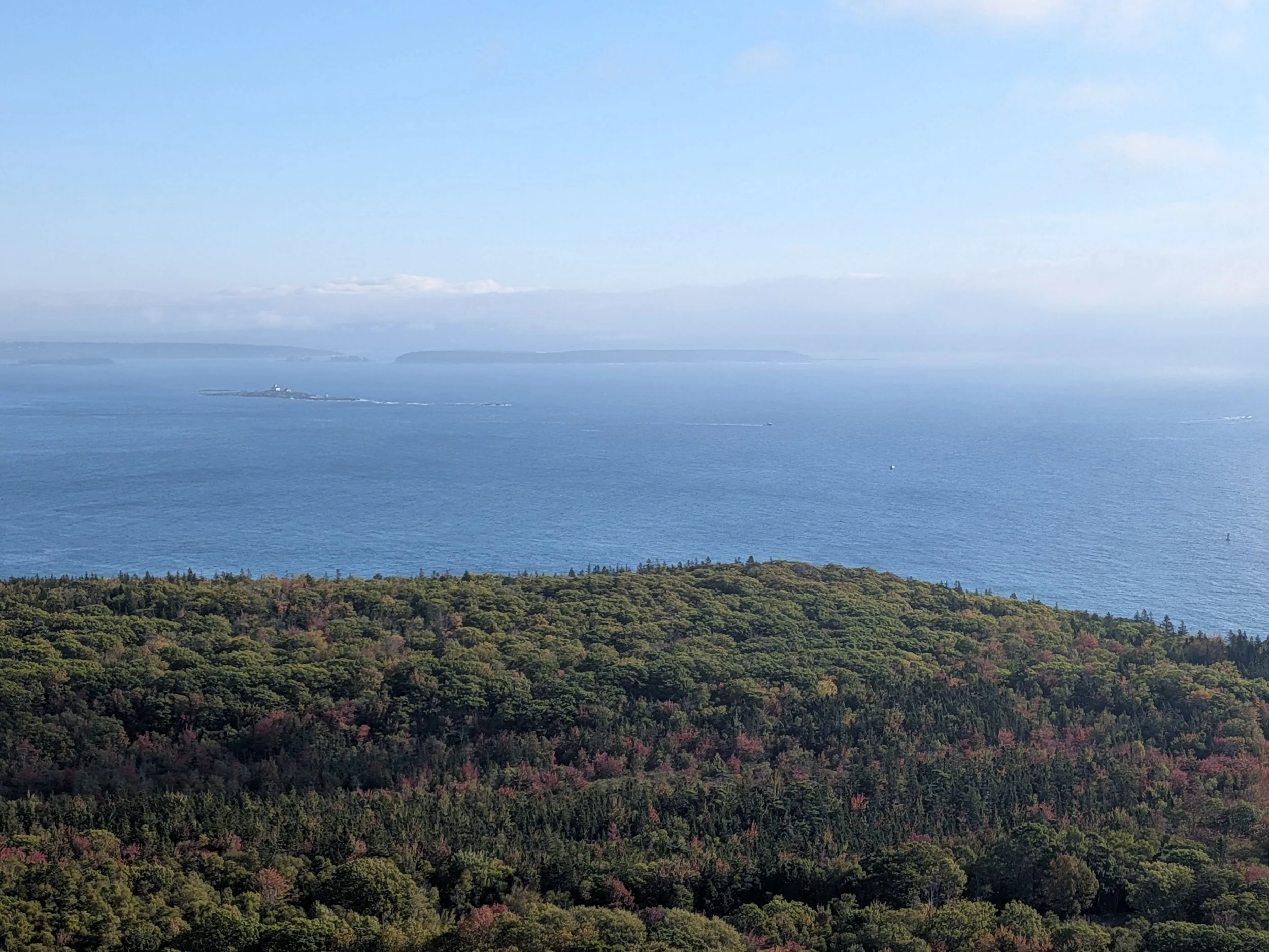 Coastline of Bar Harbor, Maine with fog in the background.