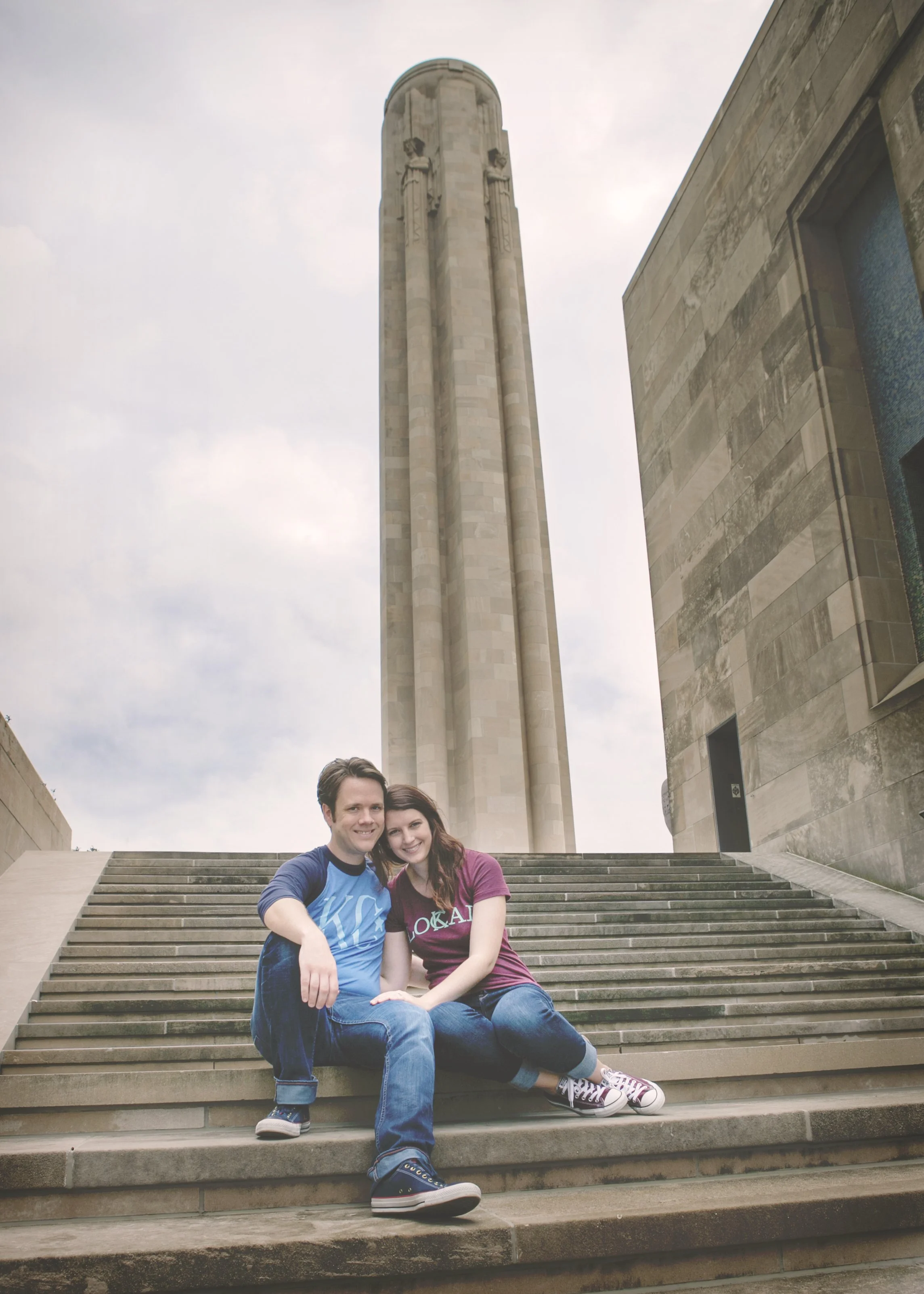 A couple posing on steps at Liberty Memorial in Kansas City