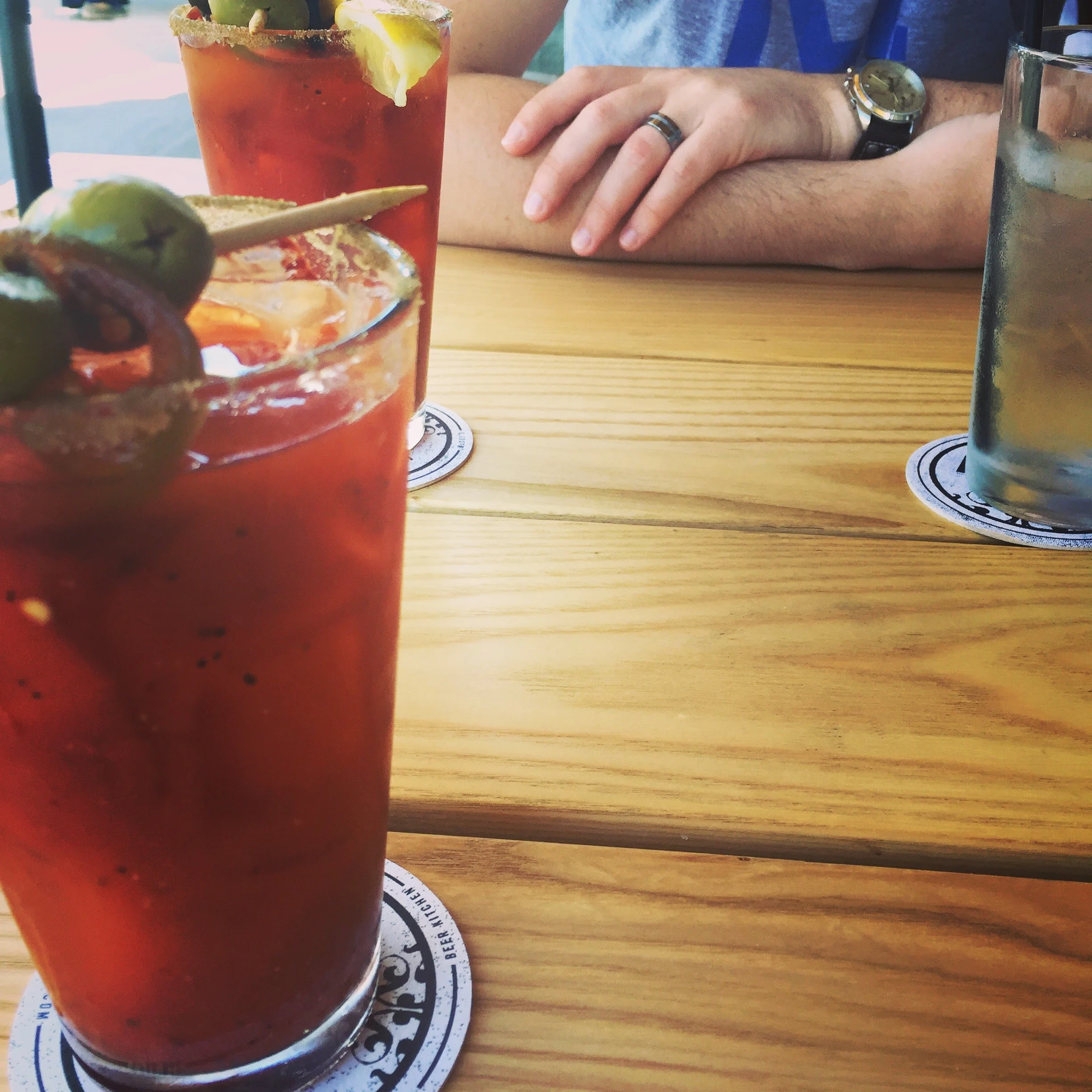 Two Bloody Marys from Char Bar on a wooden table