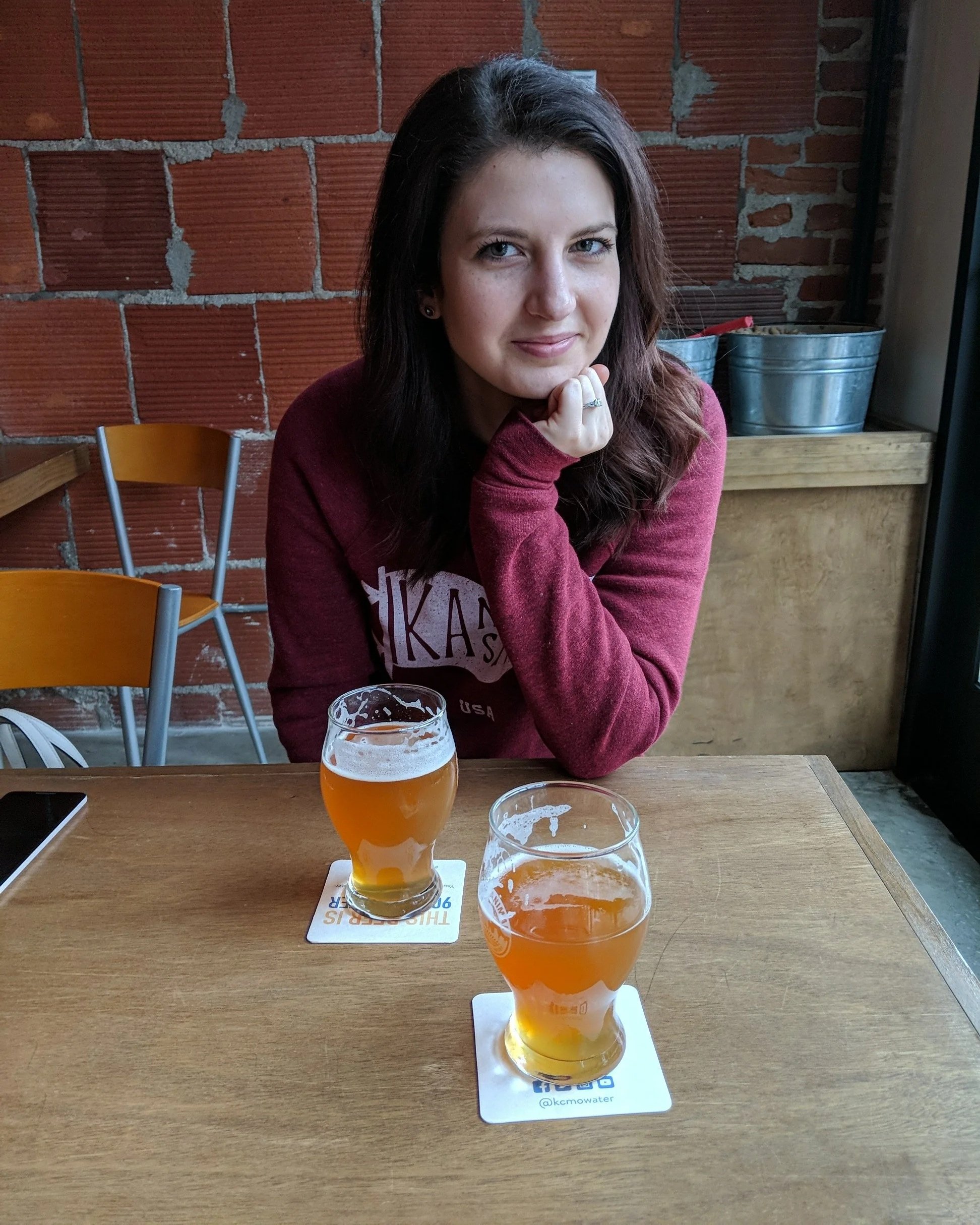 Woman enjoying beer at Causal Animal Brewing Company in Kansas City, Missouri.