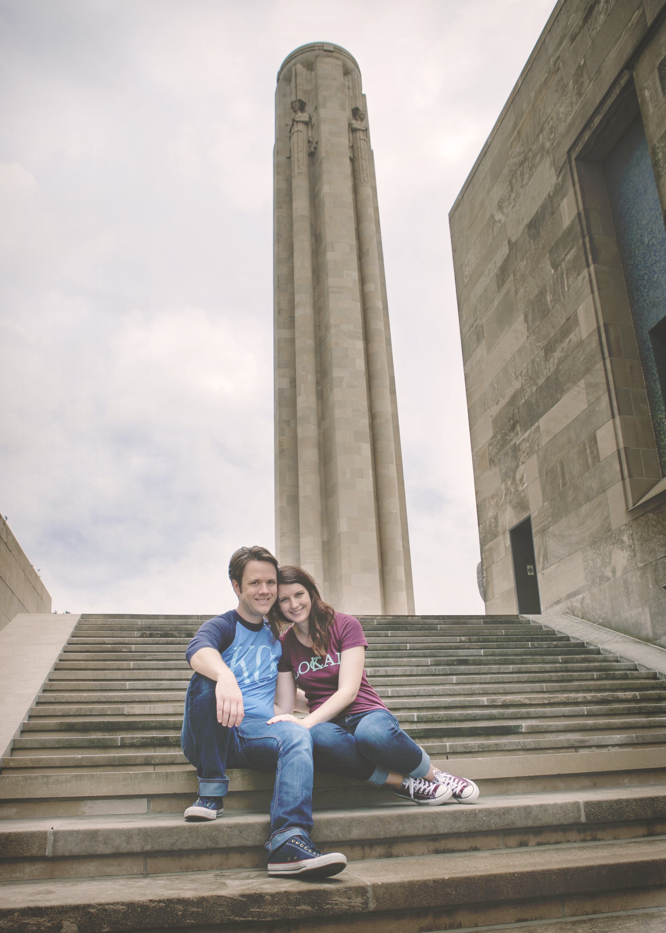 A couple posing on steps at Liberty Memorial in Kansas City