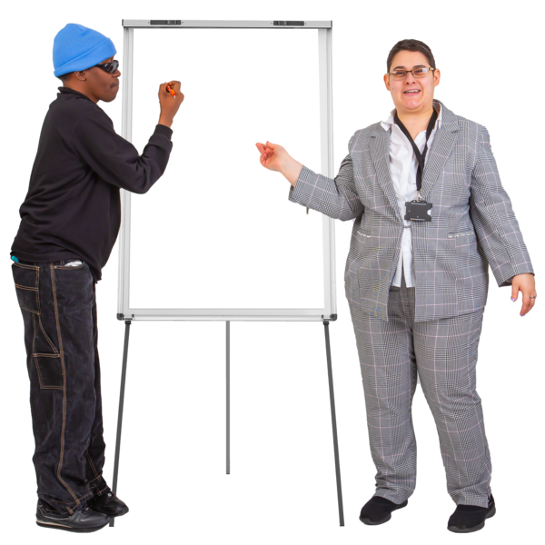 A man in a blue beanie and dressed in black writes onto a whiteboard.  A woman in a grey suit stands next to the whiteboard.