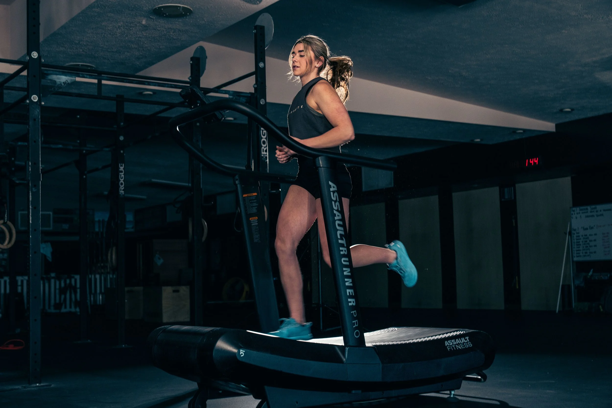 Woman running on Assault Runner treadmill.