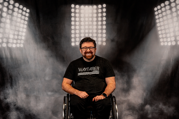 Rick Fox with black Wayfarer CrossFit shirt on a smoke lights background. 
