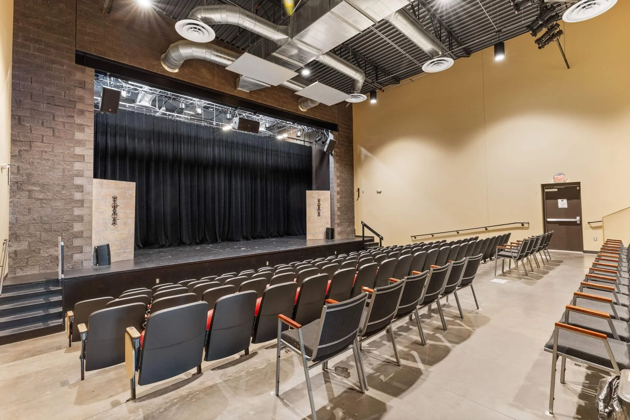 Back of an auditorium with black curtain.