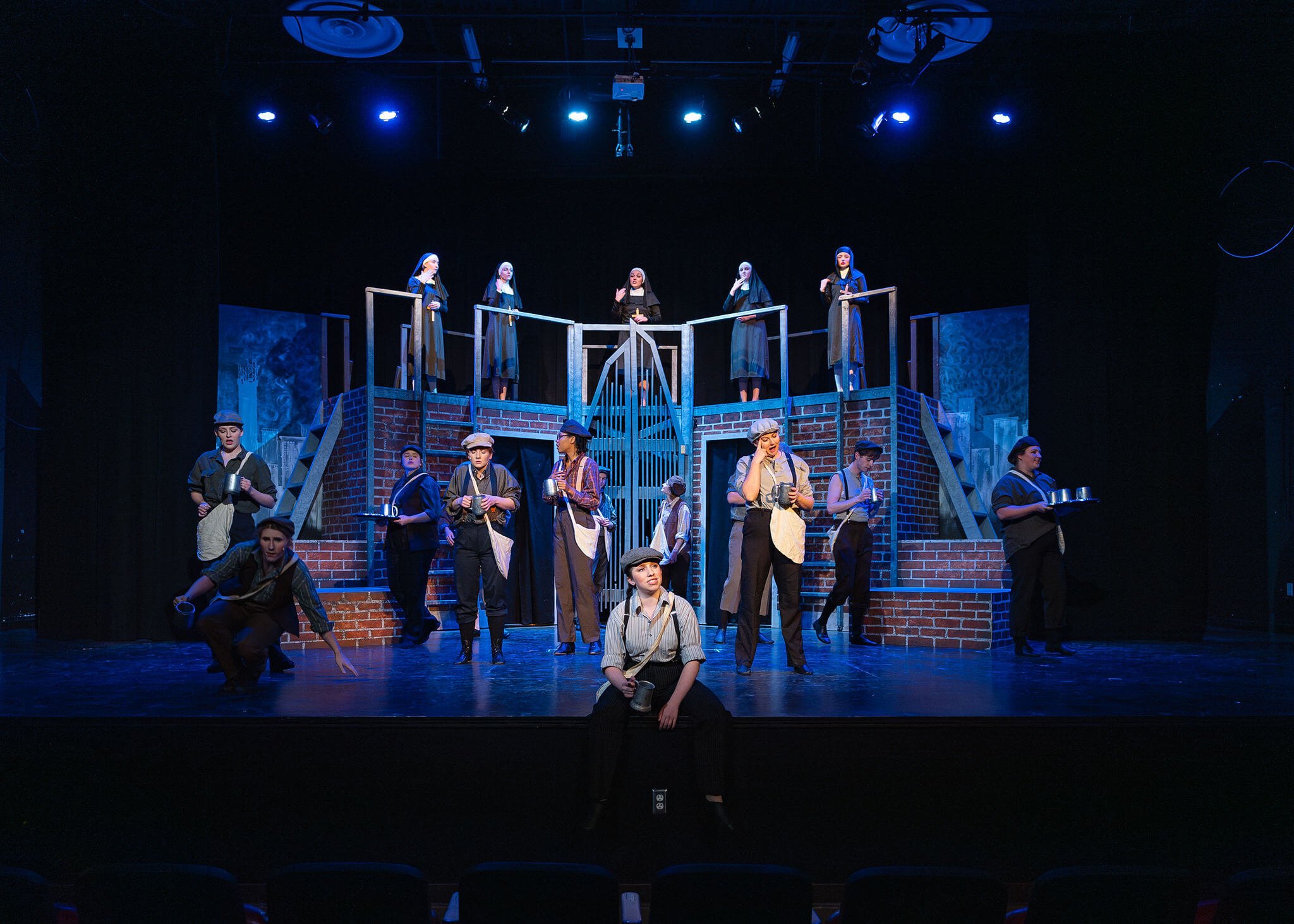 Stage adaptation of Newsies on stage.
