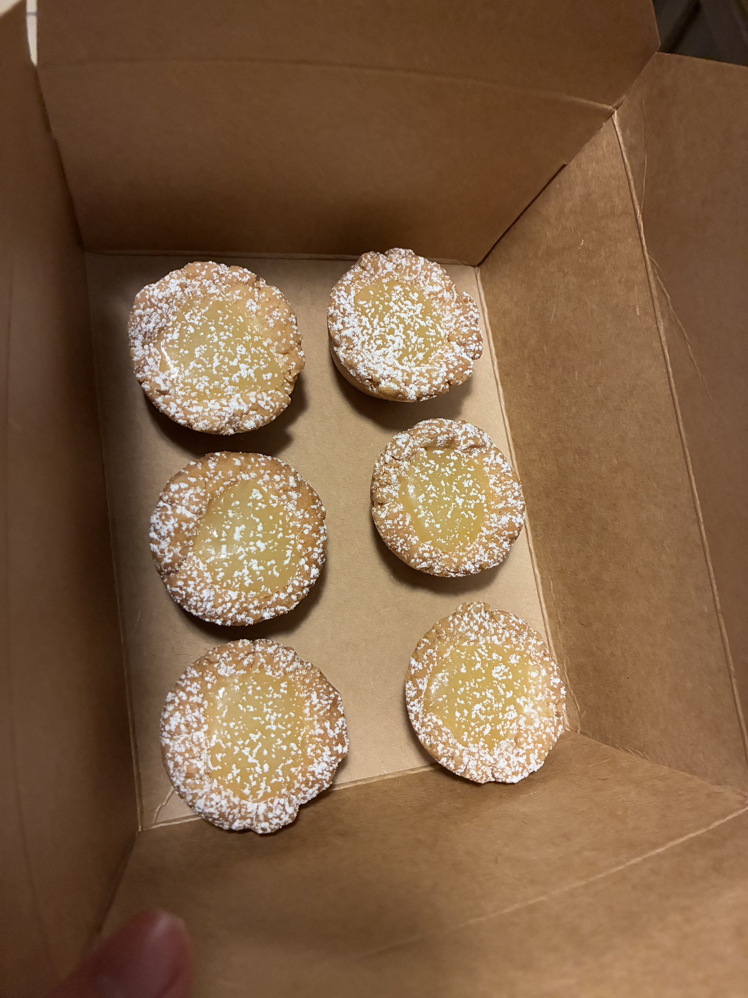 my famous mini lemon tarts dusted with powdered sugar.