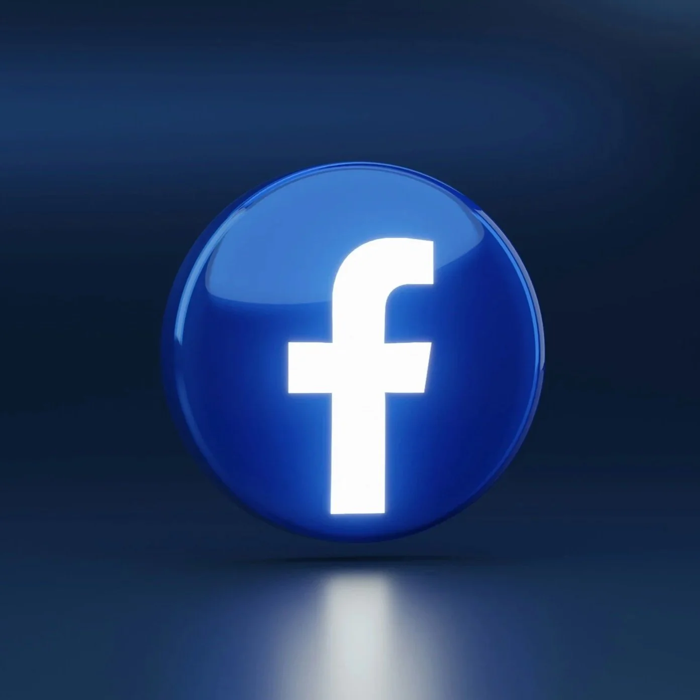 Facebook logo in a glowing blue circle set against a dark background.